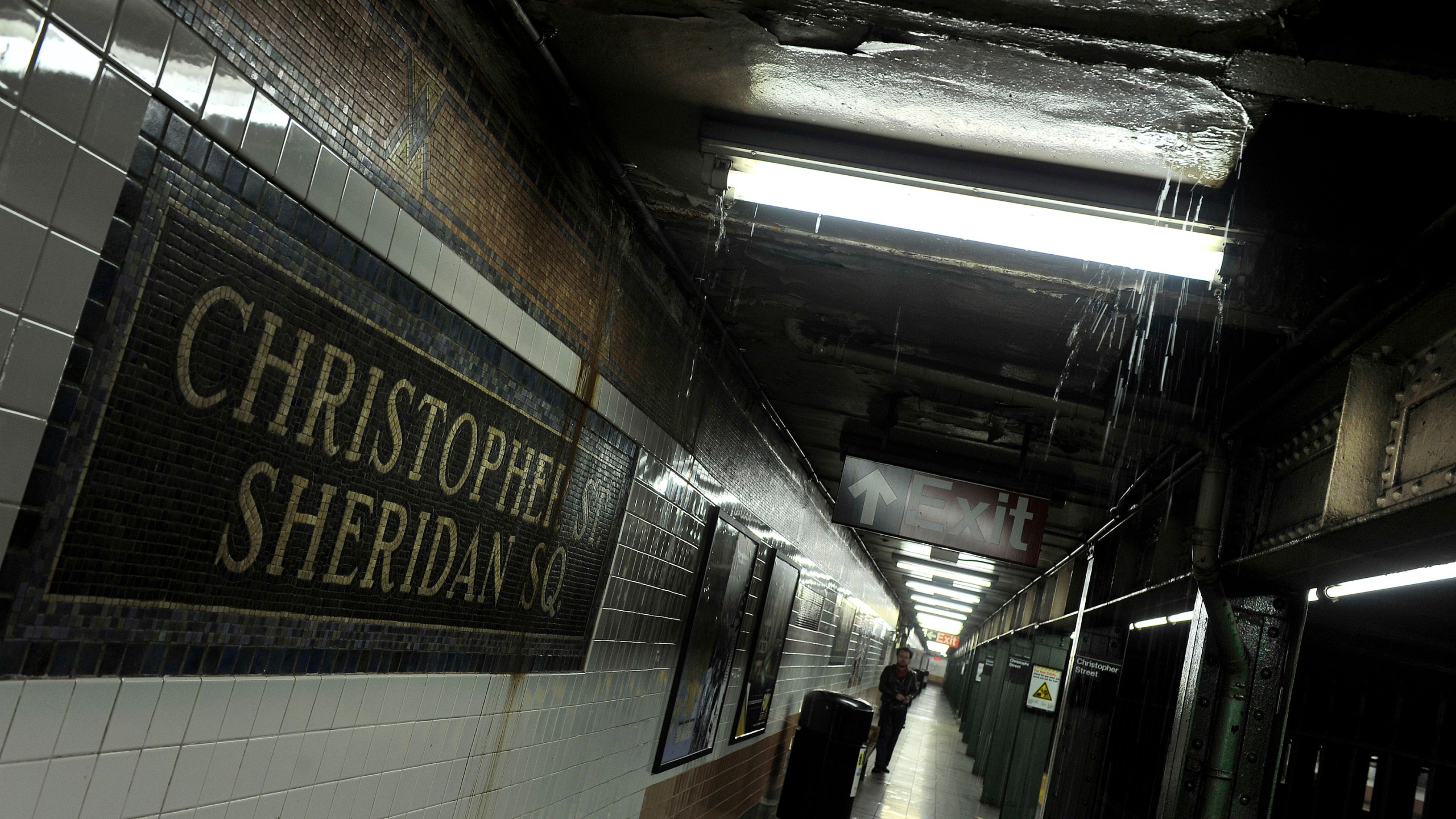 FILE - Rainwater seeps down into the Christopher Street-Sheridan Square subway station, March 30, 2010, in New York. The New York City subway station would be renamed to commemorate the Stonewall Inn protests that galvanized the modern LGBTQ rights movement, under legislation approved by state lawmakers as they wrapped up their session in June 2024. (AP Photo/Stephen Chernin, File)