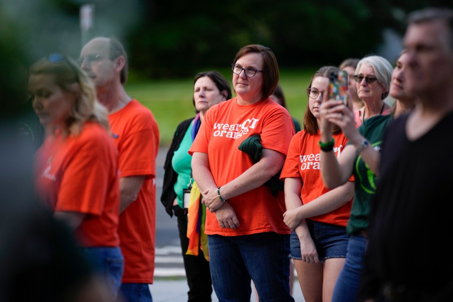 Local residents join survivors of the 2012 Sandy Hook Elementary School shooting for a rally against gun violence on Friday, June 7, 2024 in Newtown, Conn. (AP Photo/Bryan Woolston)