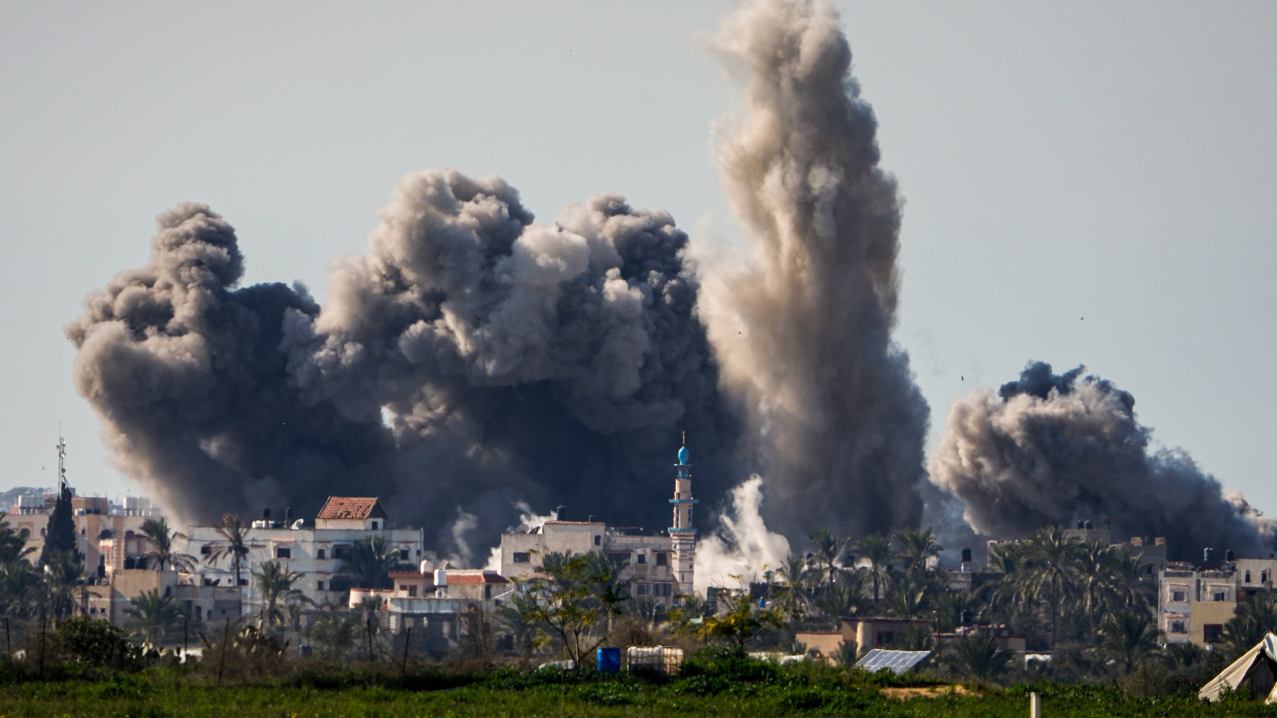 FILE - Smoke and explosion following an Israeli bombardment inside the Gaza Strip, as seen from southern Israel, Sunday, Feb. 11, 2024. The latest proposal for a cease-fire in Gaza has the support of the United States and most of the international community, but Hamas has not fully embraced it, and neither, it seems, has Israel. (AP Photo/Ariel Schalit, File)