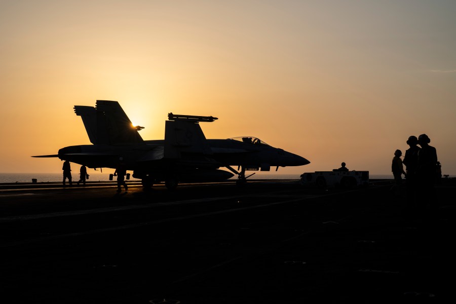 A fighter jet parks on the deck of the USS aircraft carrier Dwight D. Eisenhower, also known as 'IKE', in the Red Sea, Tuesday, June 11, 2024. (AP Photo/Bernat Armangue)