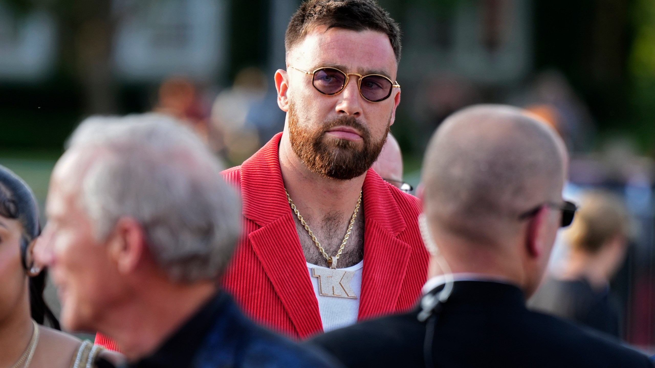 Kansas City Chiefs tight end Travis Kelce arrives at the The Nelson-Atkins Museum of Art for a ceremony for team members to receive their championship rings for winning NFL's Super Bowl 58 football game Thursday, June 13, 2024, in Kansas City, Mo. (AP Photo/Charlie Riedel)