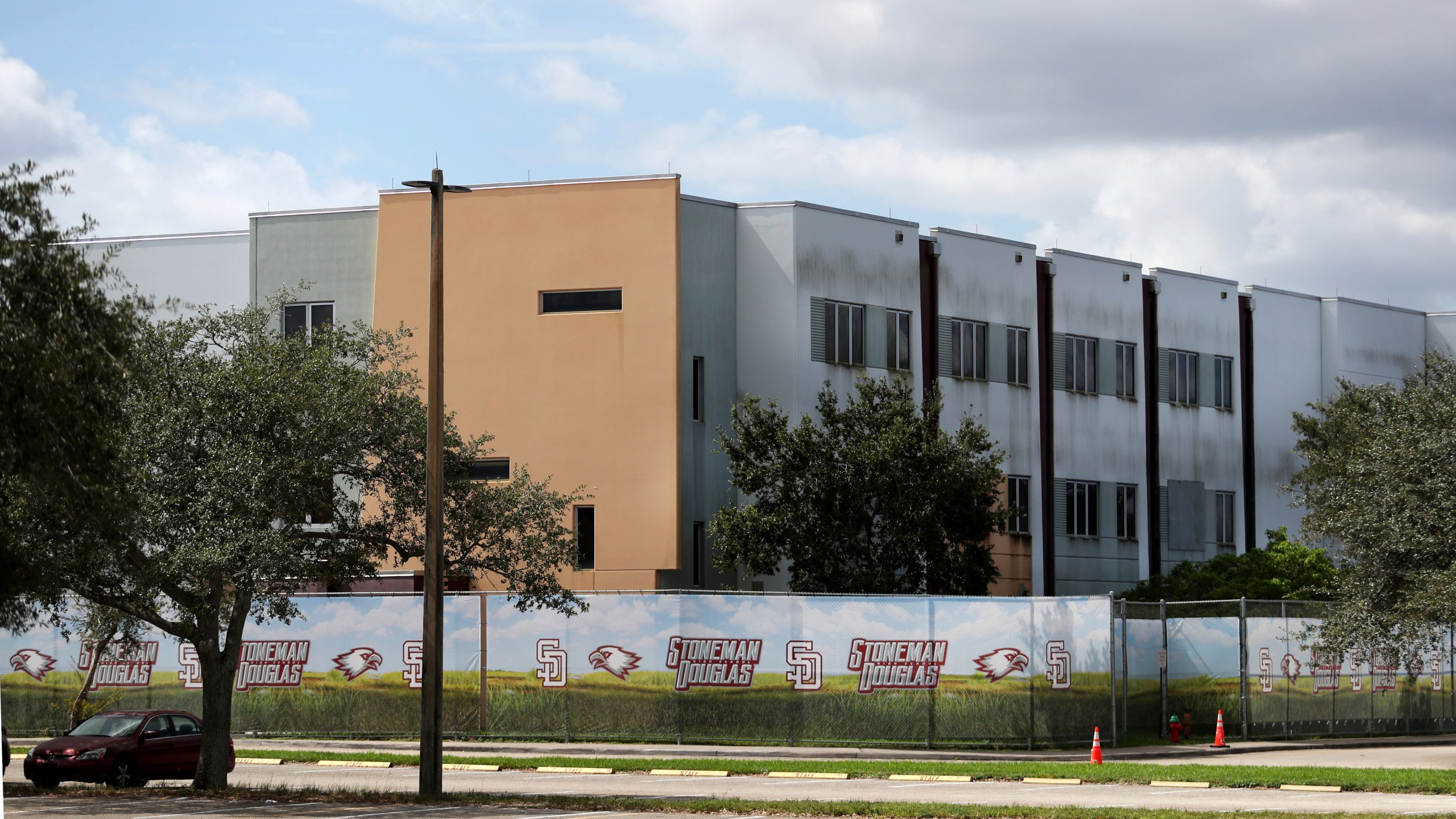 FILE - The 1200 building at Marjory Stoneman Douglas High School in Parkland, Fla., is seen, Oct. 20, 2021. Demolition of the building where 17 people died in the 2018 Parkland school shooting is set to begin, as crews will begin tearing down the three-story building at the high school on Thursday, June 13, 2024. (Carline Jean/South Florida Sun-Sentinel via AP, File)