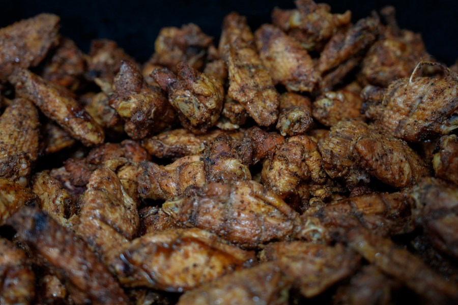 Chicken wings sit in a pan before frying, Wednesday, June 12, 2024, at a barbecue restaurant in Cincinnati. Psychologists have known for years now that men tend to eat more meat than women, but a study of people around the world now reveals that that's true across cultures. (AP Photo/Joshua A. Bickel)