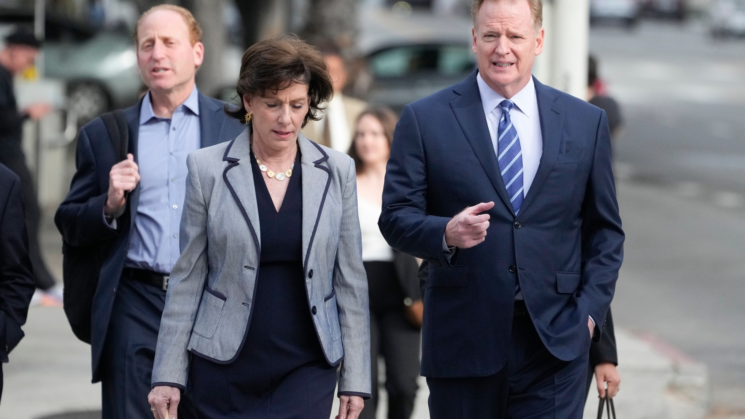 NFL Commissioner Roger Goodell, right, arrives at federal court Monday, June 17, 2024, in Los Angeles. Goodell is expected to testify as a class-action lawsuit filed by "Sunday Ticket" subscribers claiming the NFL broke antitrust laws. (AP Photo/Damian Dovarganes)