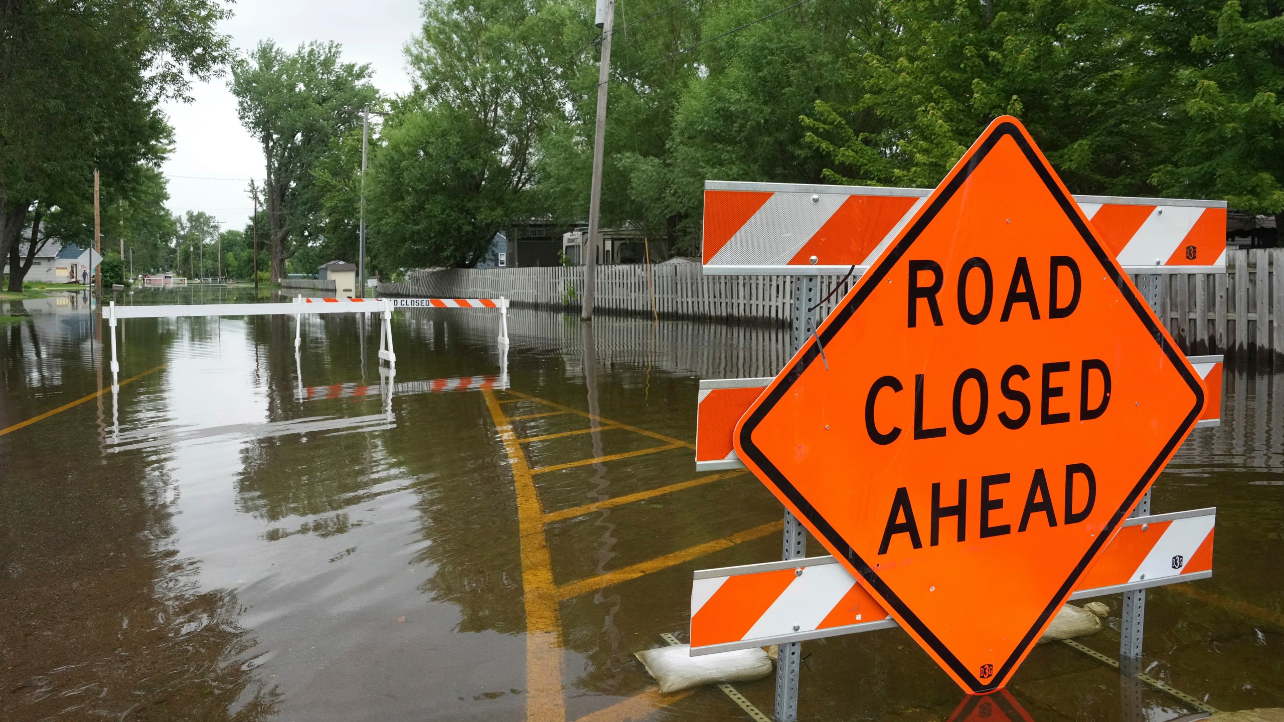 Roads are closed as heavy rains have caused both Tetonka Lake and Sakatah Lake to rise threatening to flood nearby homes and businesses Thursday, June 20, 2024, in Waterville, Minn. (Anthony Souffle/Star Tribune via AP)