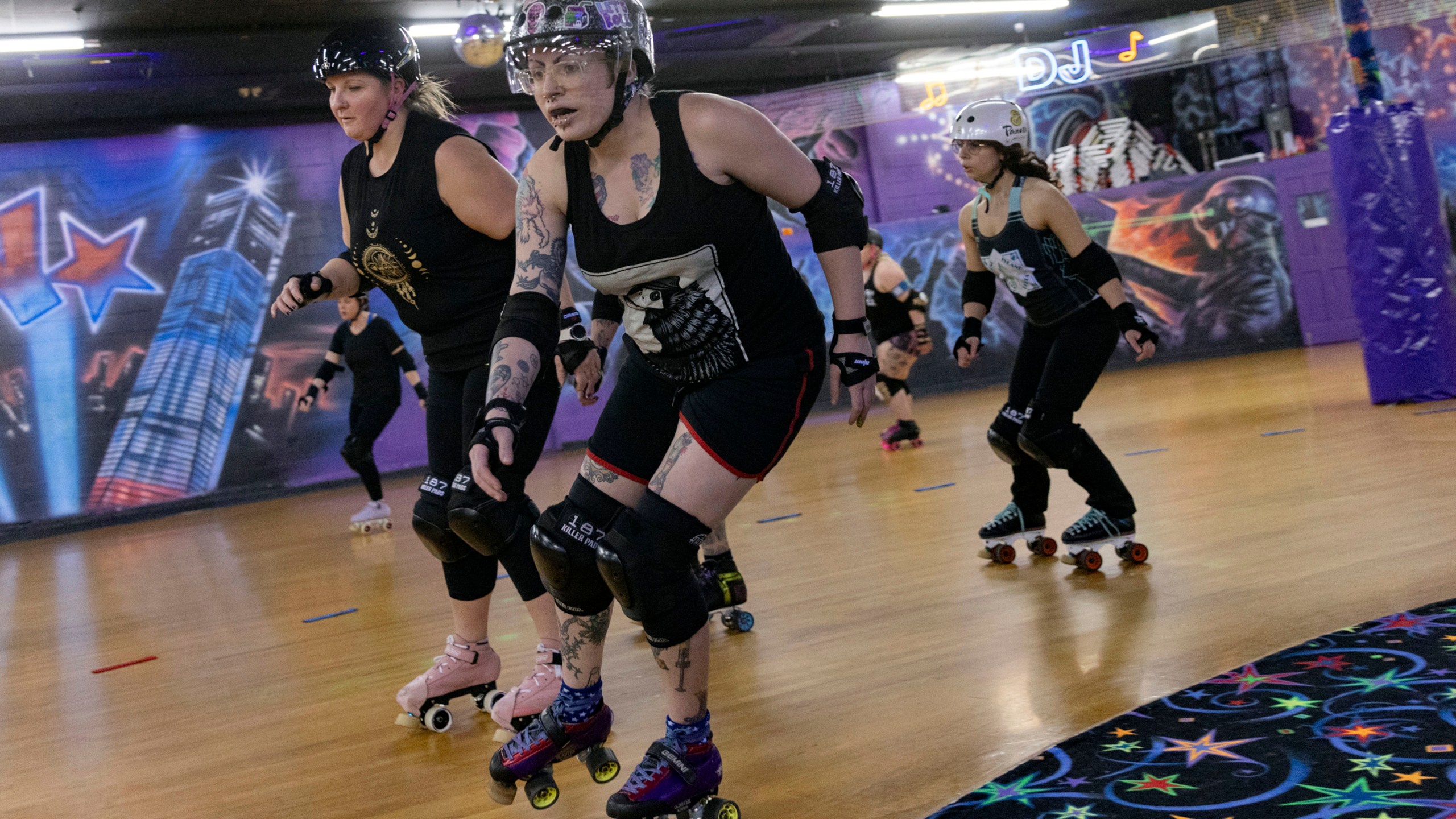 FILE - Members of the Long Island Roller Rebels practice, Mar. 19, 2023, at United Skates of America, in Seaford, NY. The Nassau County legislature, on New York's Long Island, has voted, Monday, June 24, 2024, to bar transgender female athletes from playing on girls' and women's teams at county-owned facilities after a bid to restrict trans athletes by executive order was thrown out in court. (AP Photo/Jeenah Moon, File)