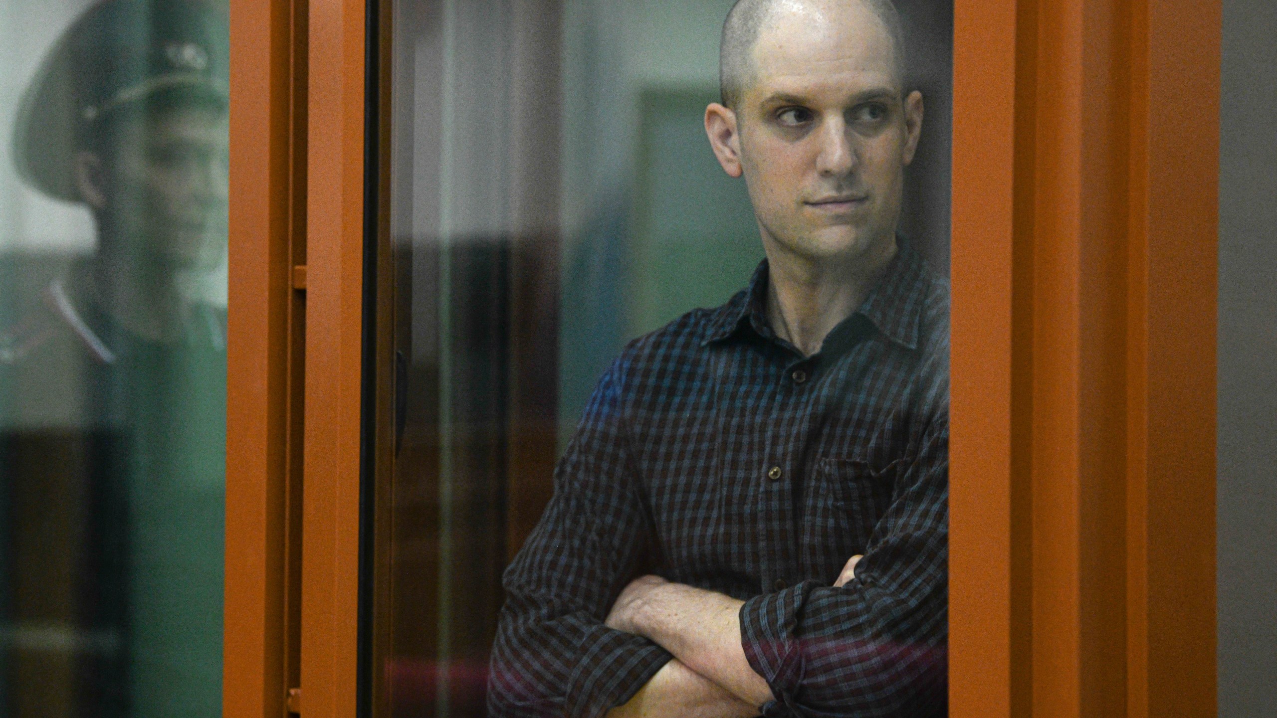 Wall Street Journal reporter Evan Gershkovich stands in a glass cage in a courtroom in Yekaterinburg, Russia, Wednesday, June 26, 2024. Fifteen months after he was arrested in the city of Yekaterinburg on espionage charges, Gershkovich returns there for his trial starting Wednesday behind closed doors. Gershkovich, his employer and the U.S. government deny the charges. (AP Photo)