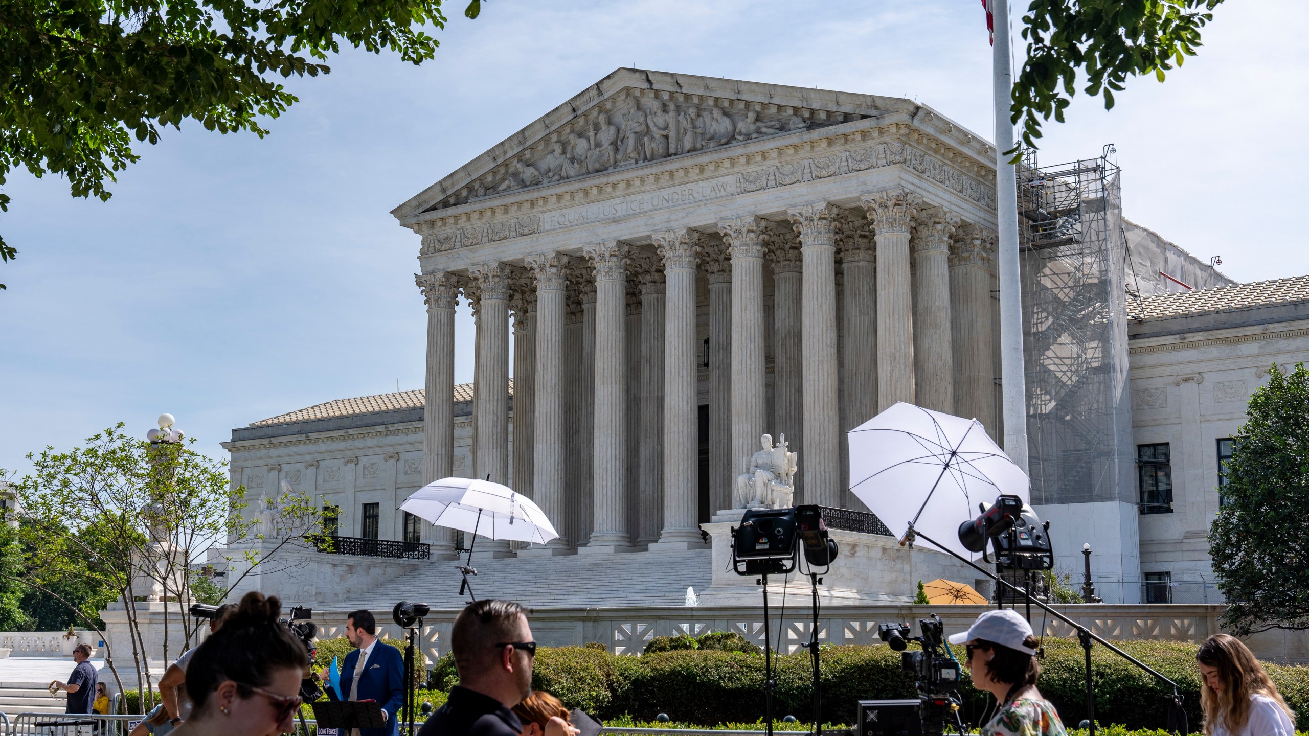 Journalists await the Court's decisions outside the Supreme Court, Wednesday, June 26, 2024, in Washington. (AP Photo/Alex Brandon)