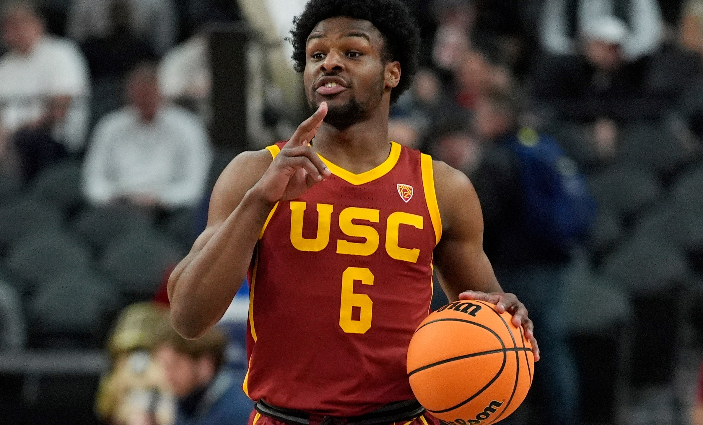 FILE - Southern California's Bronny James (6) brings the ball up the court during the first half of an NCAA college basketball game against Washington in the first round of the Pac-12 tournament Wednesday, March 13, 2024, in Las Vegas. It’s unclear where the son of NBA great LeBron James might land in this month’s NBA draft. (AP Photo/John Locher, File)