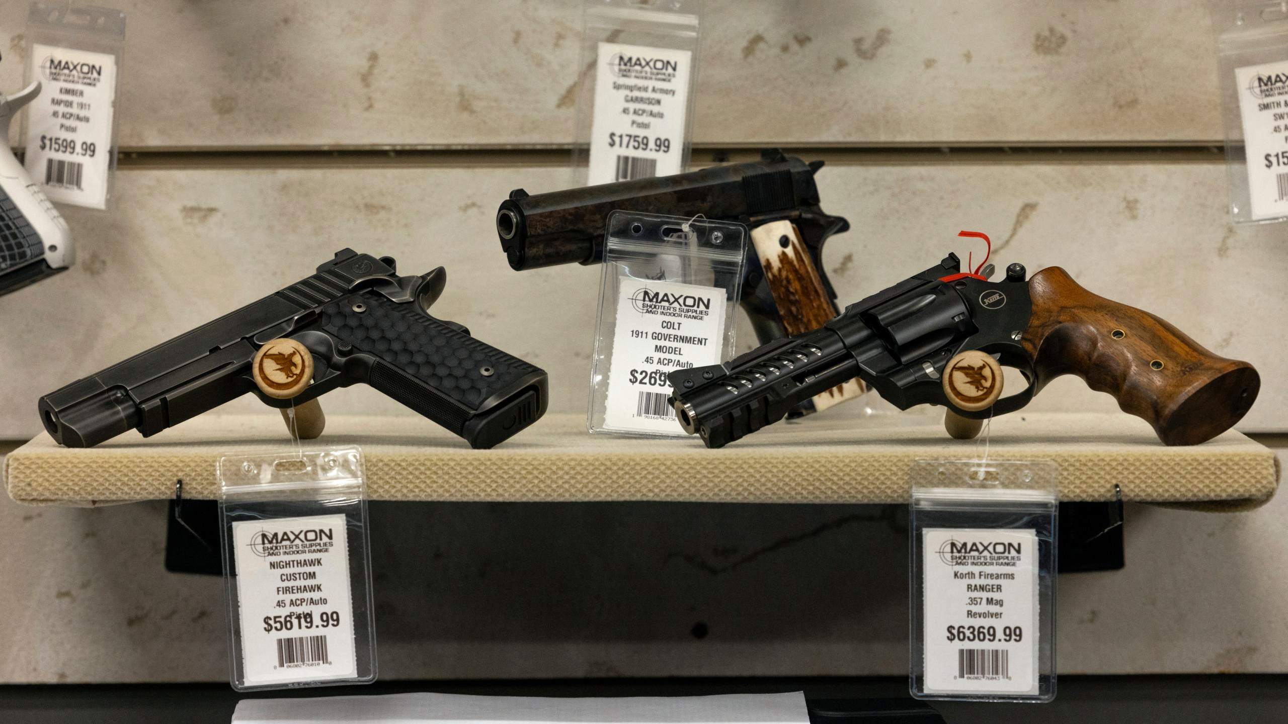 Guns for sale are displayed at Maxon Shooter's Supplies in Des Plaines, Ill.