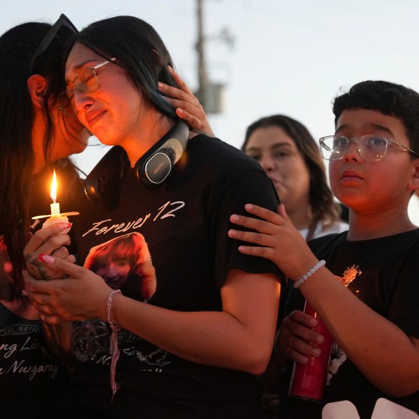 Alexis Nungaray, the mother of Jocelyn Nungaray is comforted during a vigil for her daughter June 21 2024