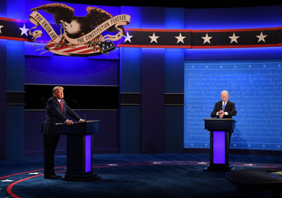 Trump and Biden stand at podiums on different sides of the stage.