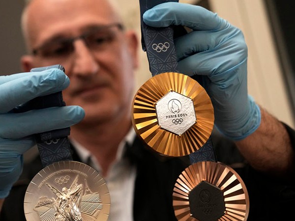 An employee holds medals for the upcoming 2024 Paris Olympics June 25, 2024