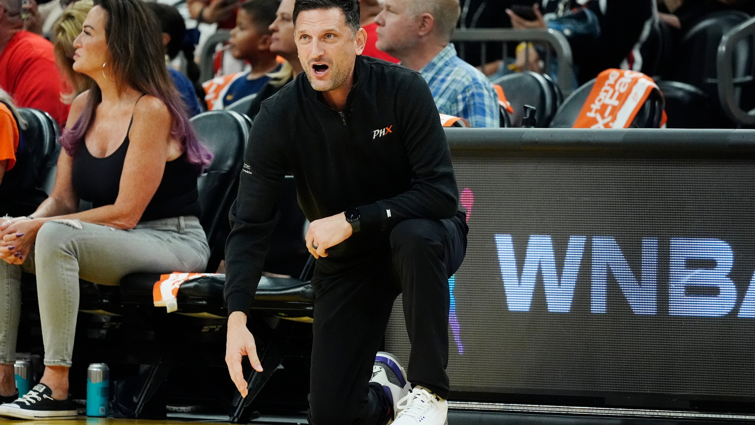 Phoenix Mercury head coach Nate Tibbetts shouts instructions during the first half of a WNBA basketball game against the Indiana Fever, Sunday, June 30, 2024, in Phoenix. The Fever won 88-82. (AP Photo/Ross D. Franklin)