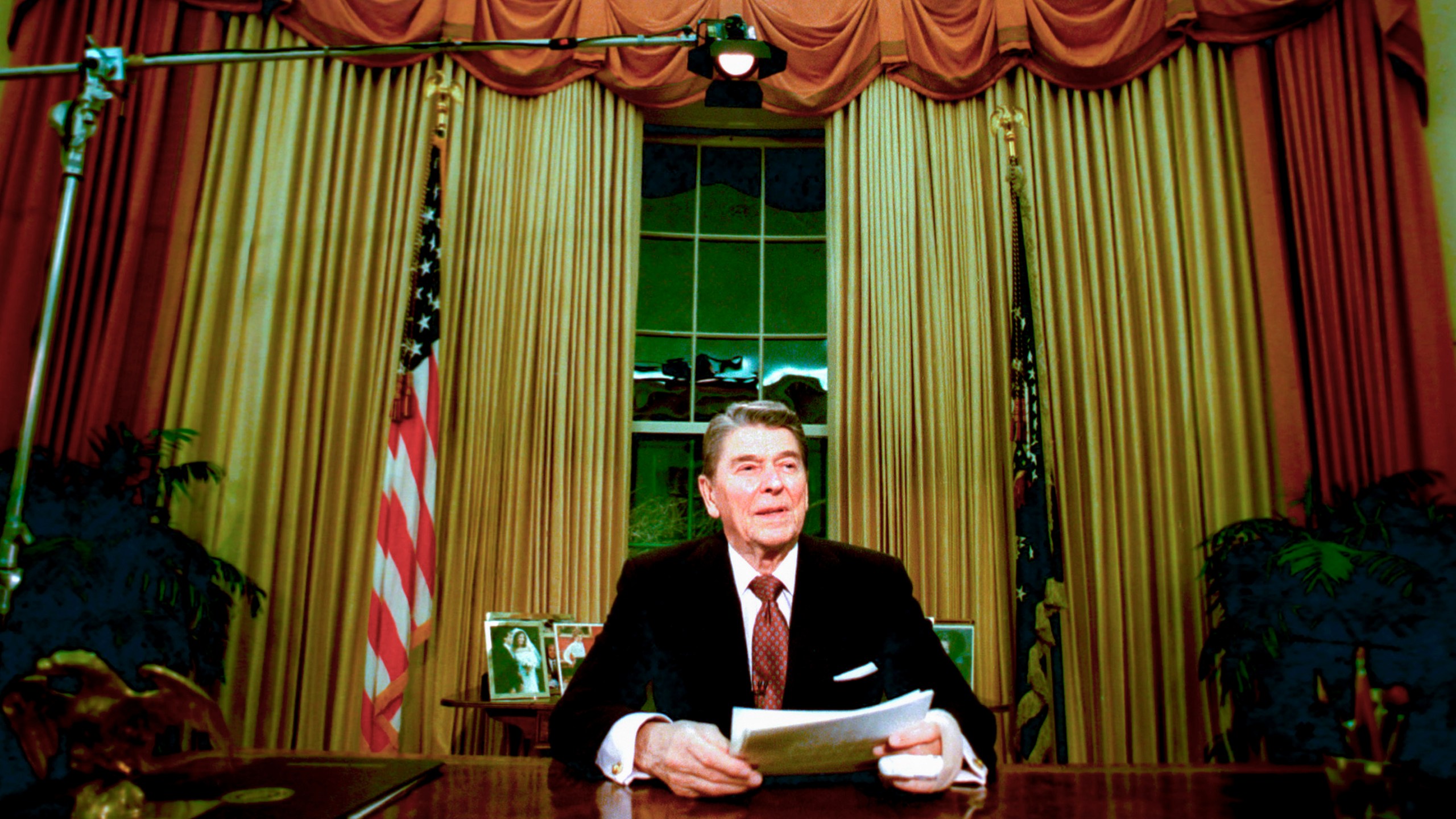 FILE - President Ronald Reagan sits in the Oval Office after he delivered his farewell address to the nation Jan. 11, 1989, from the Oval Office of the White House in Washington. The age question for presidential candidates is more than four decades old. (AP Photo/Ron Edmonds, File)