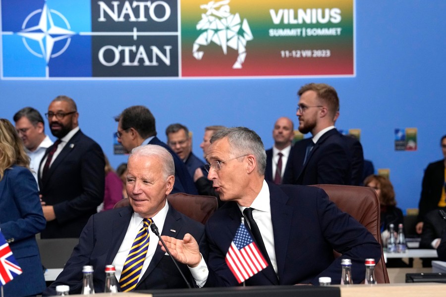 FILE - NATO Secretary General Jens Stoltenberg, right, speaks with President Joe Biden during a NATO summit in Vilnius, Lithuania, July 12, 2023. NATO allies are gathering in Washington for a summit this week, and the prospect that former President Donald Trump, the military alliance's most prominent critic, may return to power is dominating discussions. Biden's shaky performance in the presidential debate last month escalated doubts about his reelection. It's given rise to the term "Trump-proofing" or "future-proofing" NATO, making the alliance more self-sufficient. (AP Photo/Pavel Golovkin, File)