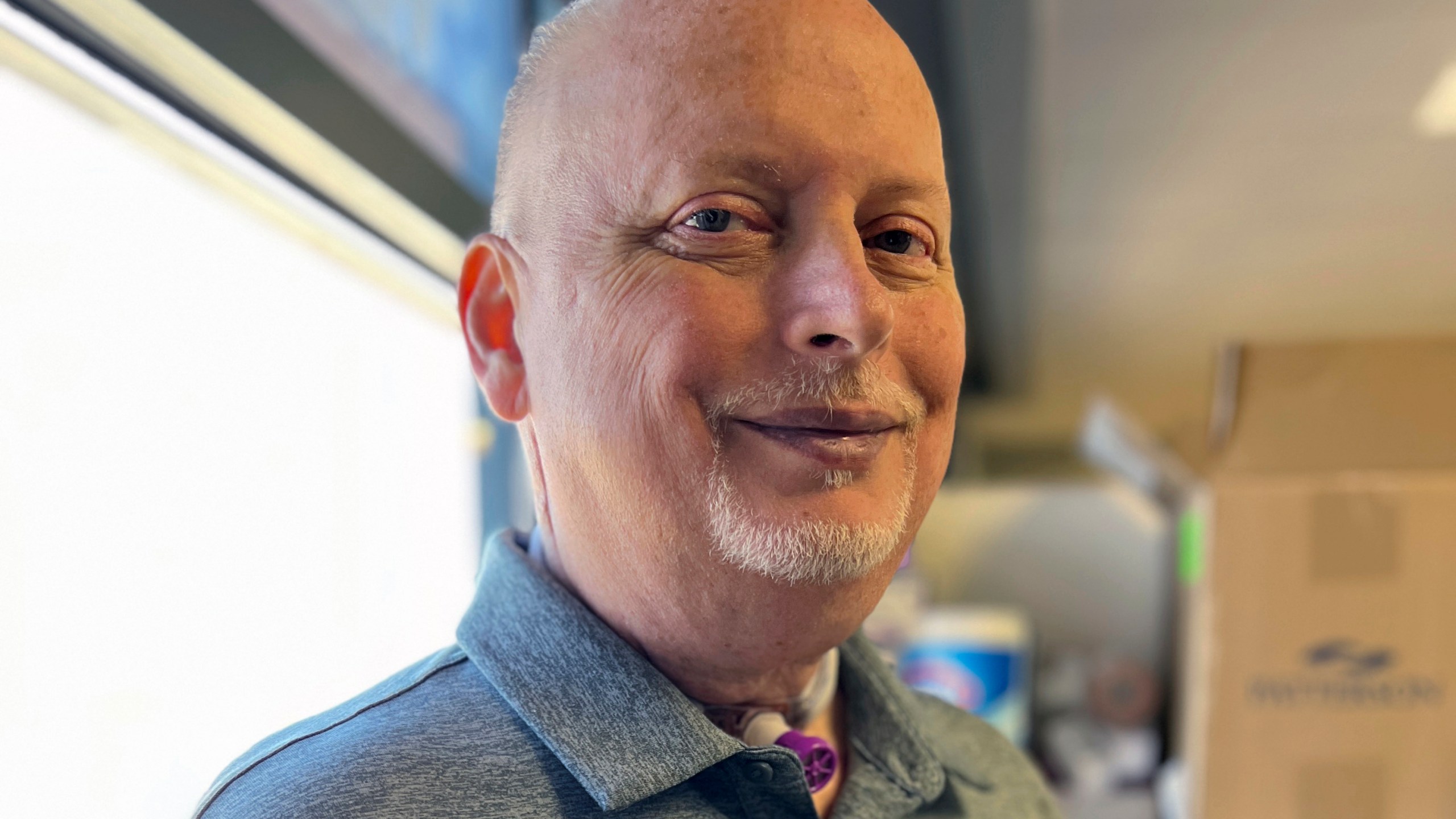 In this photo provided by the Mayo Clinic, Marty Kedian poses for a photo in Mayo Clinic’s Head and Neck Regenerative Medicine Laboratory in Scottsdale, Ariz., on June 12, 2024. Kedian regained his voice after surgeons removed his cancerous larynx and, in a pioneering move, immediately replaced it with a donated one. (Mayo Clinic via AP)