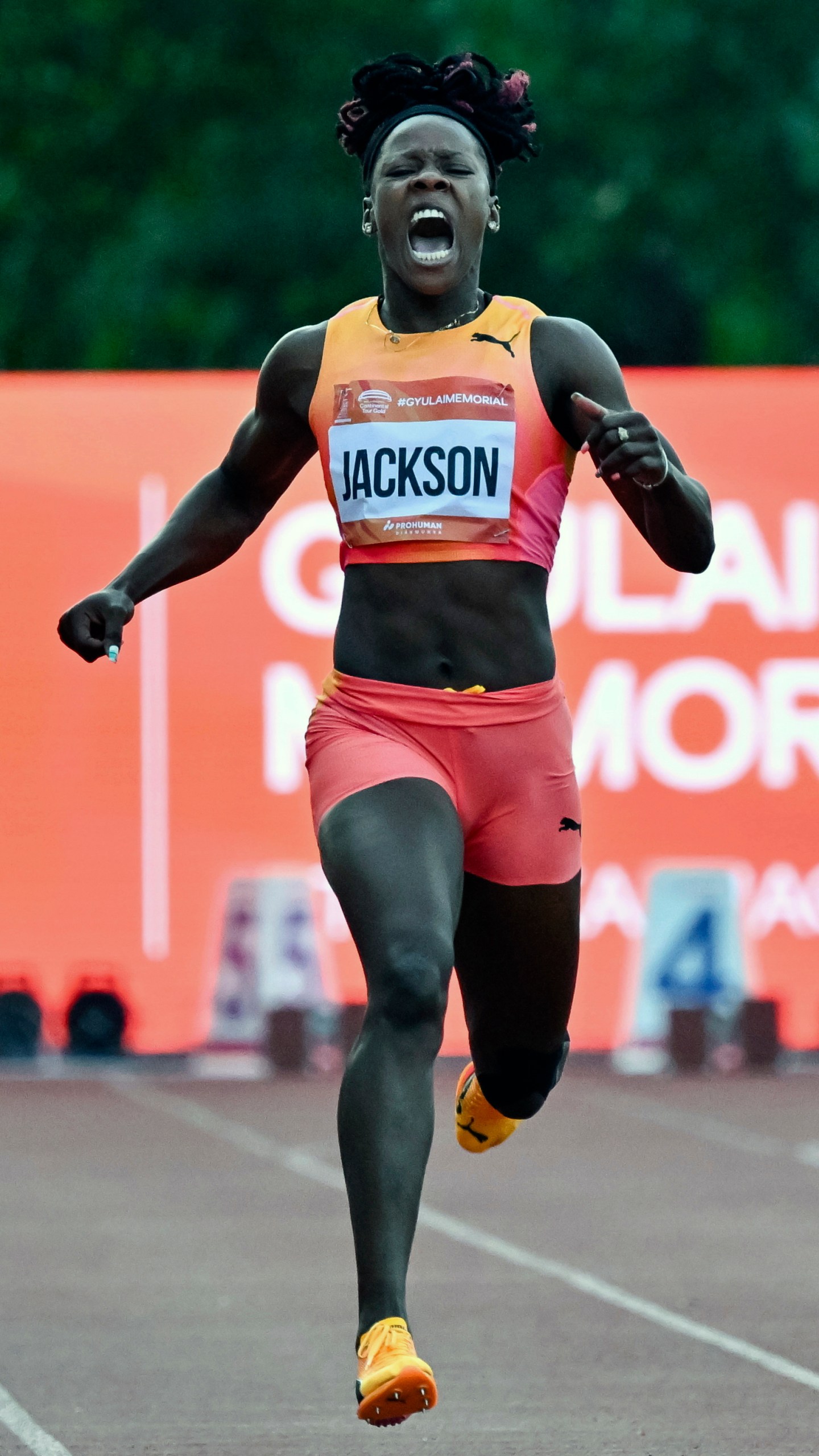 Shericka Jackson, of Jamaica, reacts to an injury during the women's 200 meter event at the Gyulai Istvan Memorial Track and Field Hungarian Grand Prix in Szekesfehervar, Hungary, Tuesday, July 9, 2024. (Tamas Vasvari/MTI via AP)