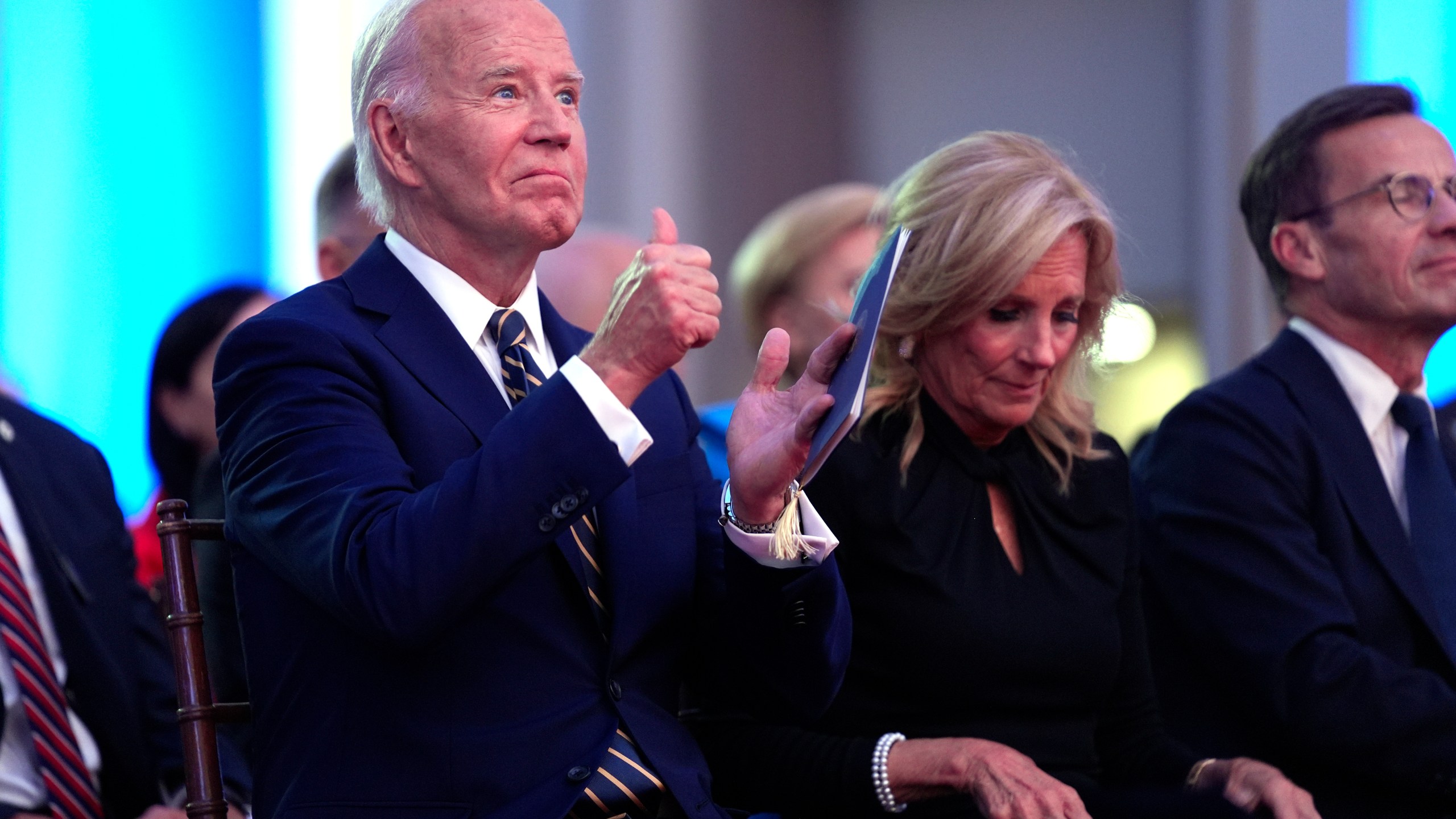 President Joe Biden, left, and first lady Jill Biden sit in the audience before Biden delivers remarks on the 75th anniversary of NATO at the Andrew W. Mellon Auditorium, Tuesday, July 9, 2024, in Washington. (AP Photo/Evan Vucci)