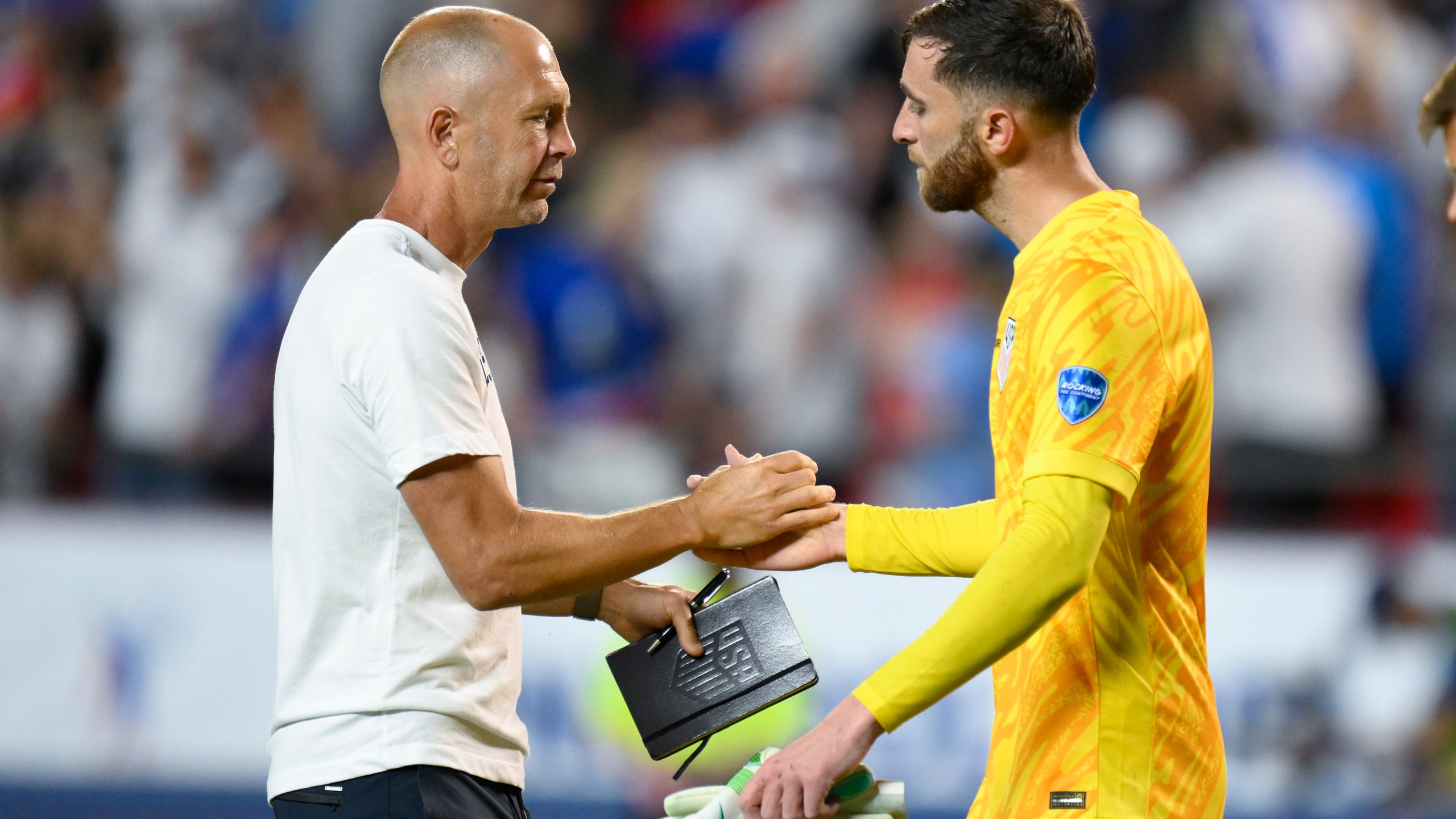 FILE - Coach Gregg Berhalter of the United States greets goalkeeper Matt Turner after losing 0-1 against Uruguay at the end of a Copa America Group C soccer match in Kansas City, Mo., July 1, 2024. Berhalter was fired as U.S. men's soccer coach Wednesday, July 10, after his team's first-round exit from the Copa America flamed doubts he was the right person to remain in charge for the 2026 World Cup, a person familiar with the decision told The Associated Press. (AP Photo/Reed Hoffman, File)