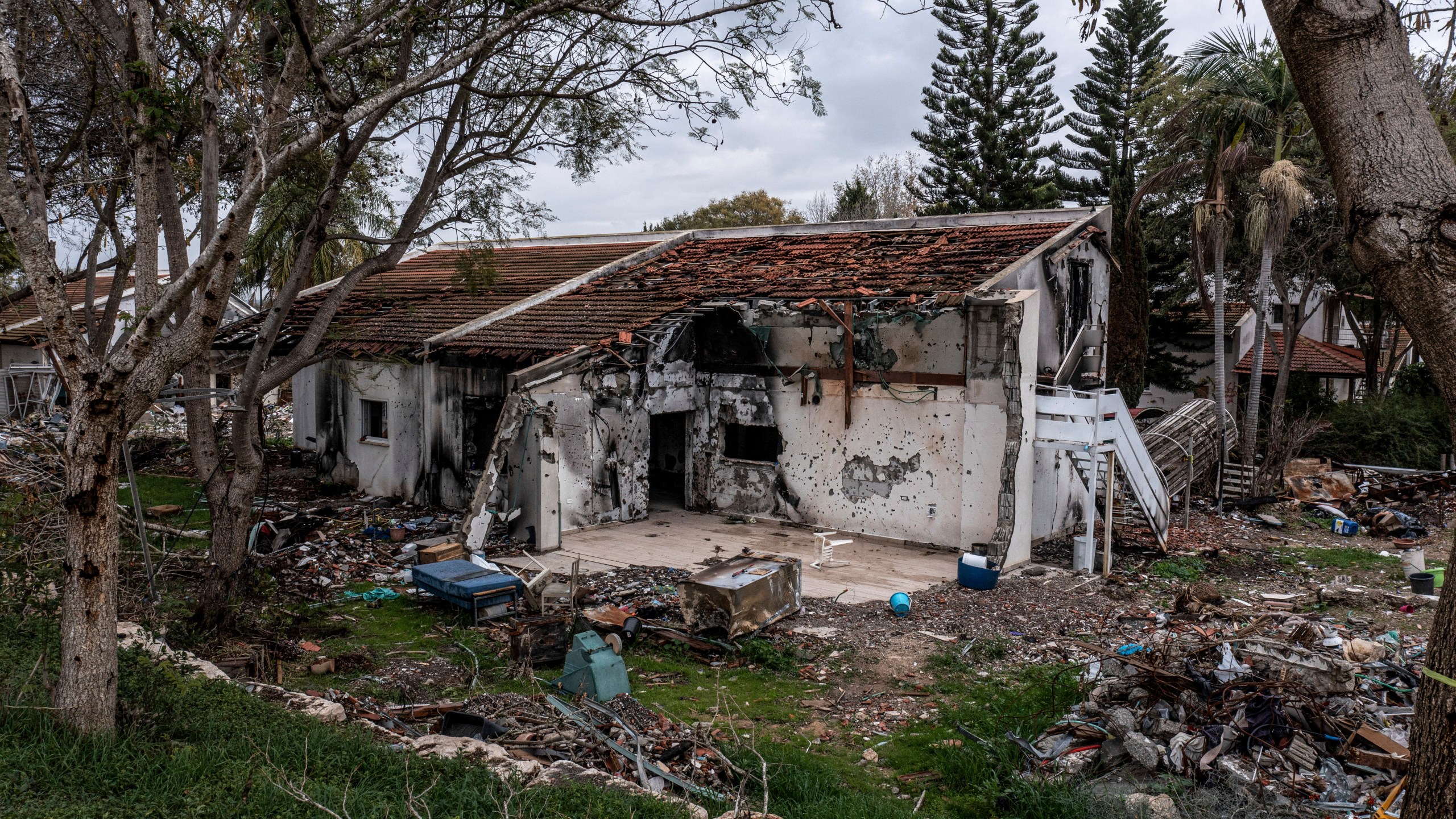 FILE - A battle-scarred home in Kibbutz Be'eri, an Israeli communal farm on the Gaza border, is seen on Thursday, Jan. 11, 2024. Hamas held more than a dozen hostages in the home when it overran southern Israel on Oct. 7. The Israeli military said Thursday that Israeli hostages held in a home that was struck by tank fire last Oct. 7 were killed by Hamas militants, not Israeli shelling, as it released the results of its first investigation into failures during the deadly attack that triggered the nine-month war in Gaza. (AP Photo/Tsafrir Abayov, File)