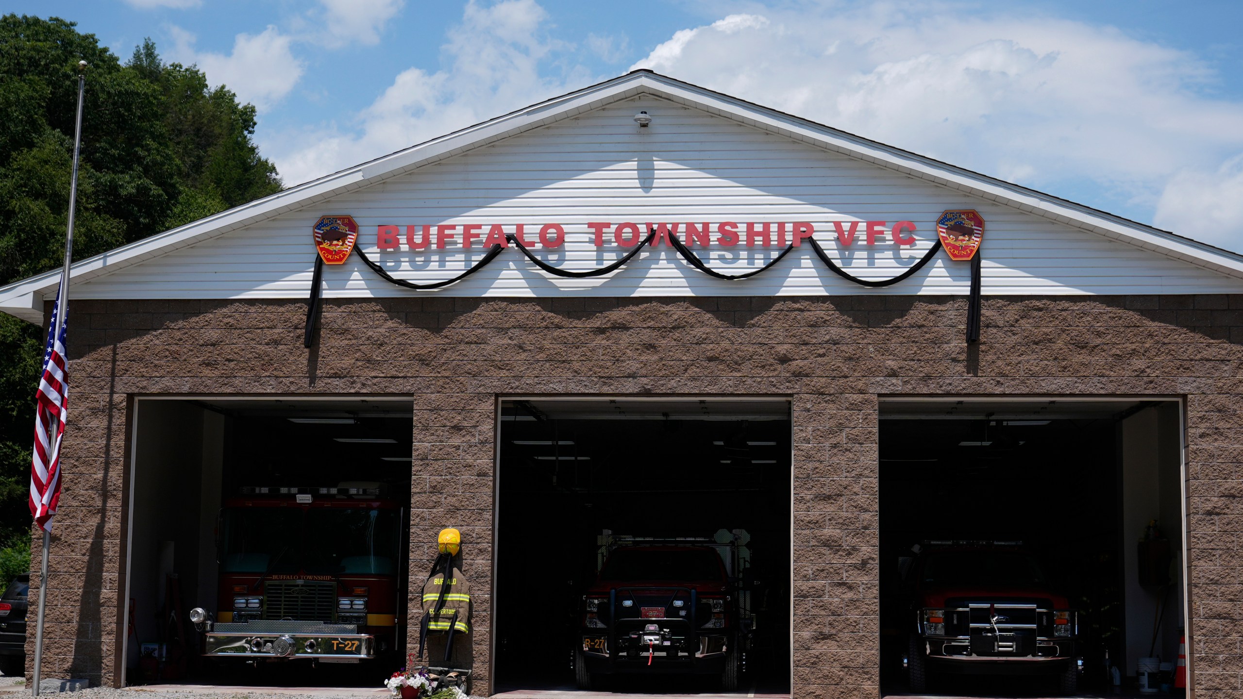 Flowers and a tribute to fallen firefighter Corey Comperatore are pictured at the Buffalo Township Volunteer Fire Company in Buffalo Township, Pa., Monday, July 15, 2024. Comperatore was shot and killed at the Trump rally in Butler, Pa., Saturday, July 13, 2024. (AP Photo/Sue Ogrocki)