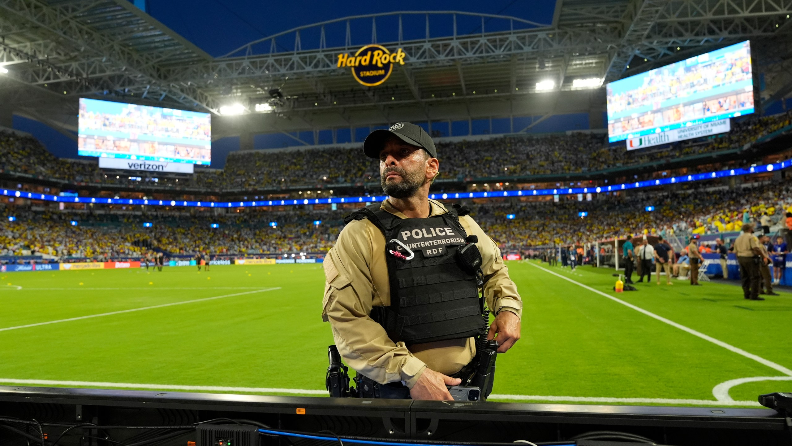 A police stands on the field prior to the Copa America final soccer match between Argentina and Colombia in Miami Gardens, Fla., Sunday, July 14, 2024. (AP Photo/Rebecca Blackwell)