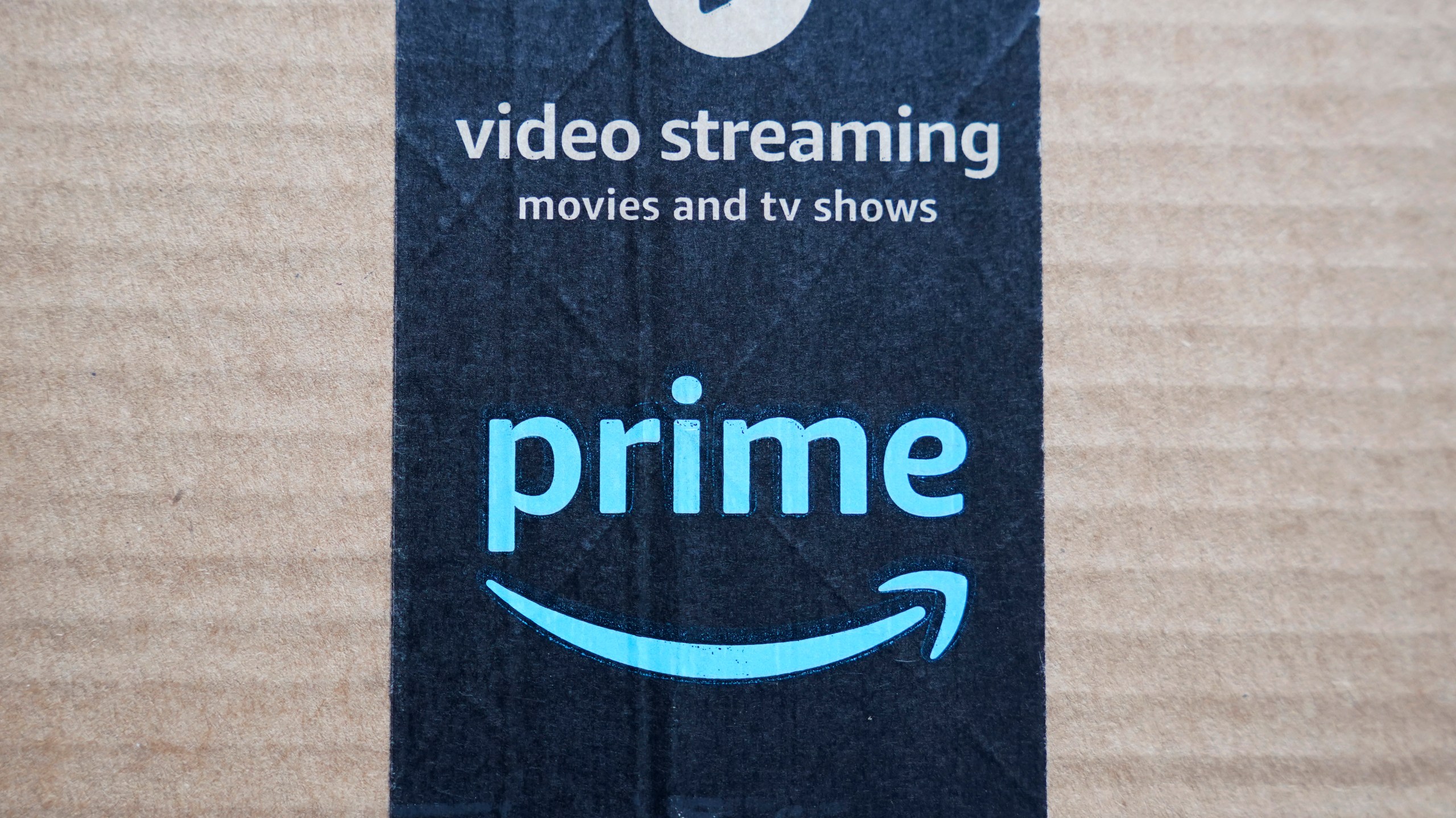 FILE - An Amazon Prime cardboard shipping box label is seen on March 17, 2023, in East Derry, N.H. Amazon Prime Day is here. And experts are reminding consumers to be wary of scams. (AP Photo/Charles Krupa, File)