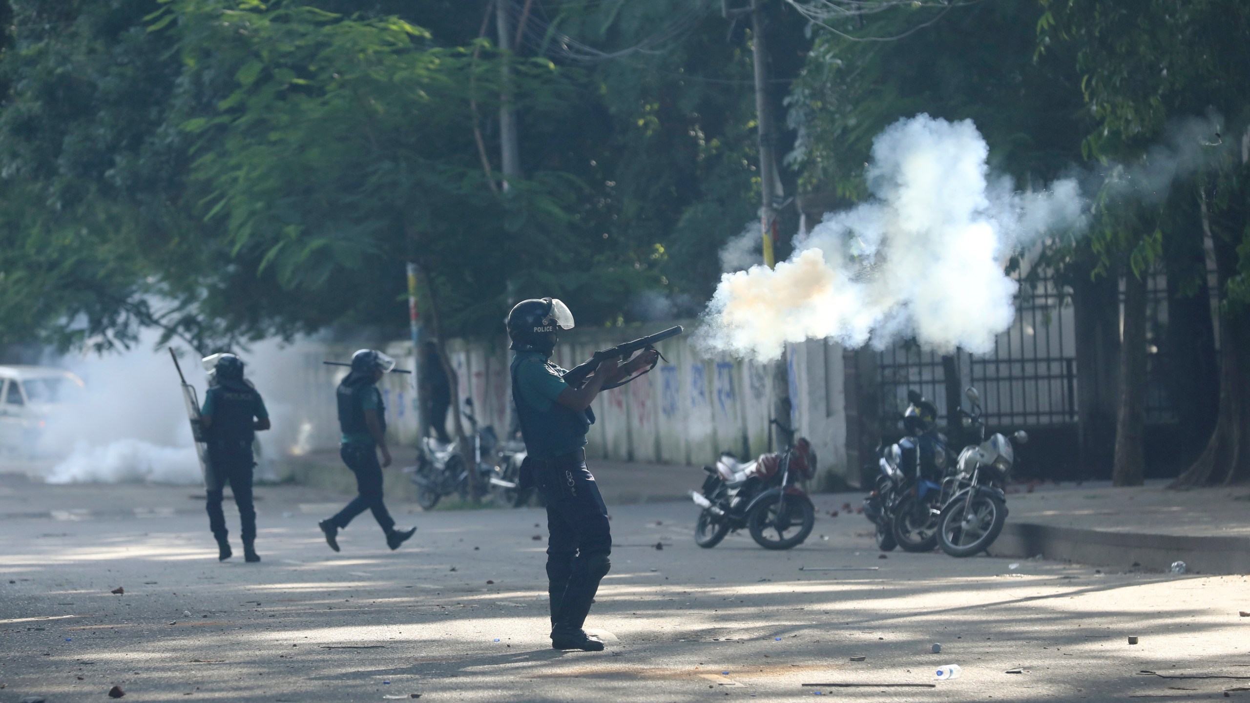 Police fire tear gas shells and rubber bullets to disperse students shouting slogans in favor of quota system in public service at the university campus, in Dhaka, Bangladesh, Wednesday, July 17, 2024. (AP Photo/Rajib Dhar)