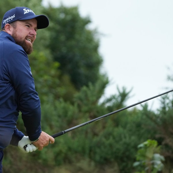 Shane Lowry of Ireland hits off the 12th tee during his opening round of the British Open Golf Championships at Royal Troon golf club in Troon, Scotland, Thursday, July 18, 2024. (AP Photo/Jon Super)