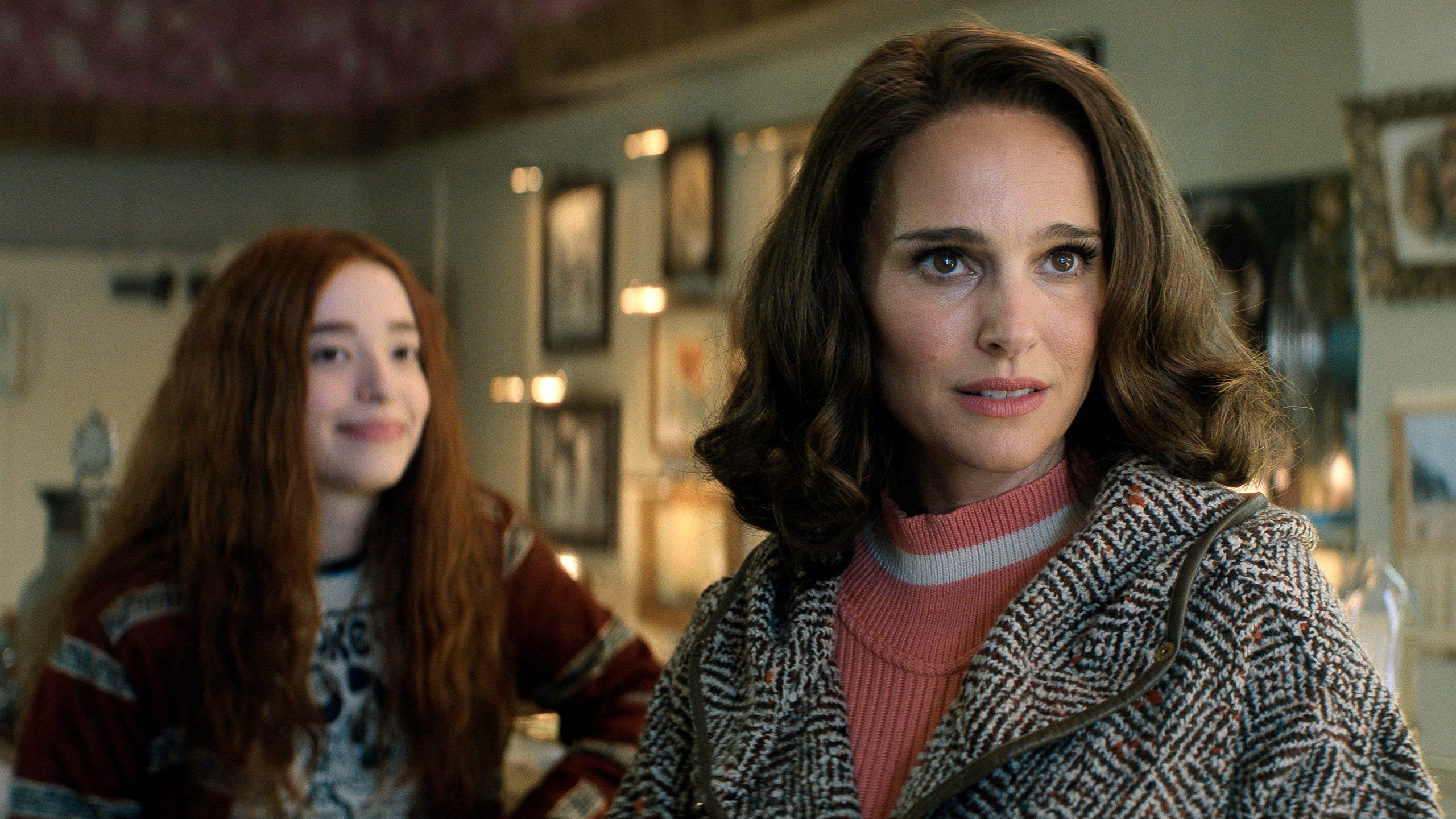 This image released by Apple TV+ shows Mikey Madison, left, and Natalie Portman in a scene from "The Lady in the Lake." (Apple TV+ via AP)