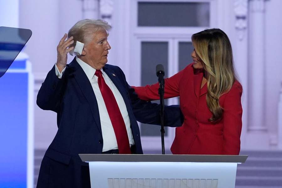 Republican presidential candidate former President Donald Trump is joined on stage by former first lady Melania Trump at the Republican National Convention Thursday, July 18, 2024, in Milwaukee. (AP Photo/J. Scott Applewhite)