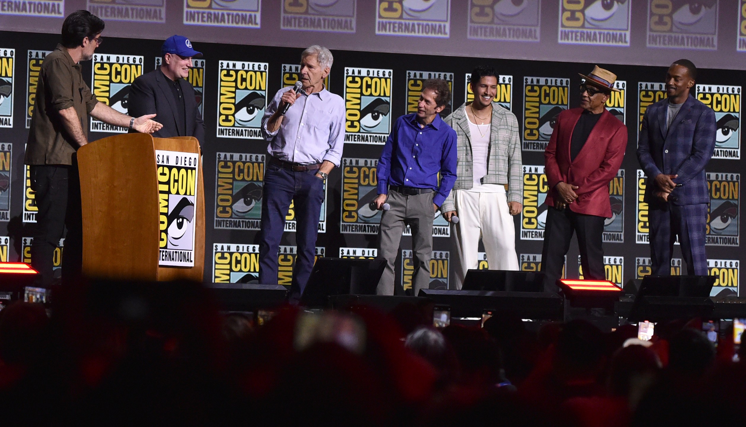 Rob Delaney, from left, Kevin Feige, Harrison Ford, Tim Blake Nelson, Danny Ramirez, Giancarlo Esposito, and Anthony Mackie attend a panel for Marvel Studios during Comic-Con International on Saturday, July 27, 2024, in San Diego. (Photo by Richard Shotwell/Invision/AP)