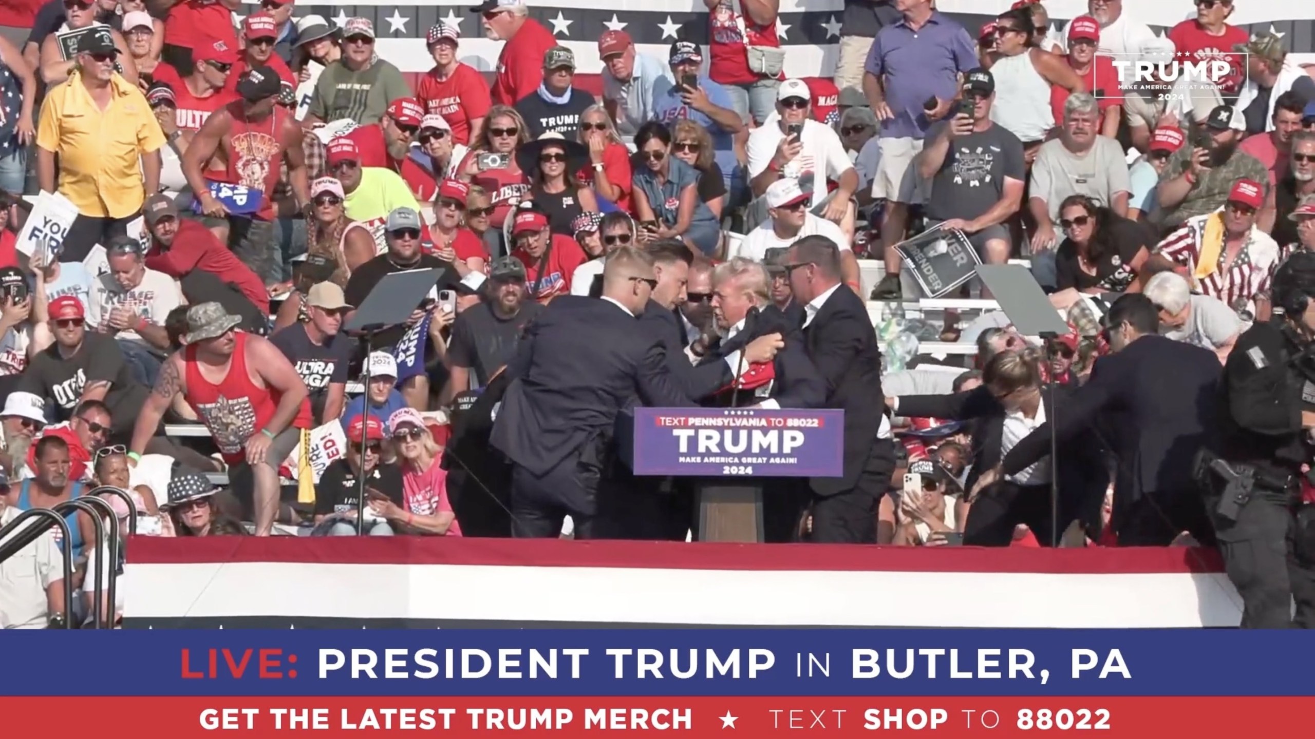 Former President Donald Trump appears to be injured after gunshots were reported as he is rushed offstage during a rally on July 13, 2024 in Butler, Pennsylvania.