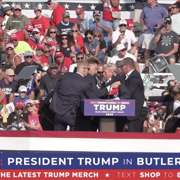 Former President Donald Trump appears to be injured after gunshots were reported as he is rushed offstage during a rally on July 13, 2024 in Butler, Pennsylvania.