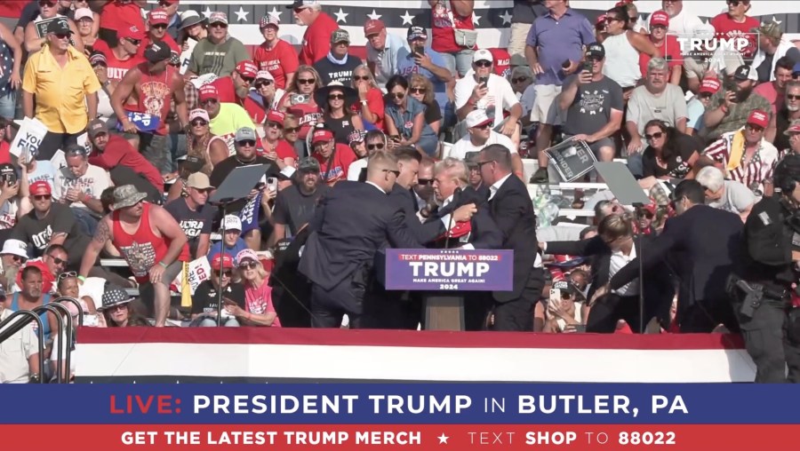 Former President Donald Trump appears to be injured after gunshots were reported as he is rushed offstage during a rally on July 13, 2024 in Butler, Pennsylvania.