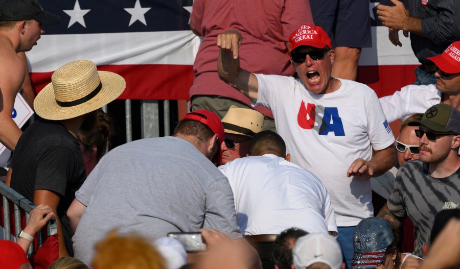 Attendees scatter after gunfire rang out during a campaign rally for Republican presidential candidate, former U.S. President Donald Trump.