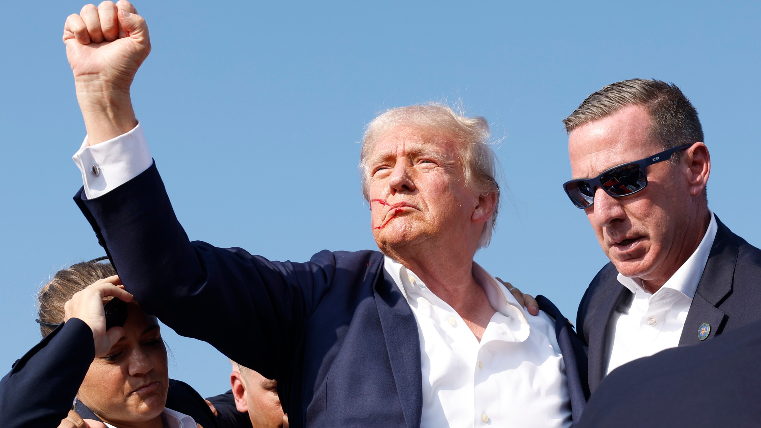 Former President Donald Trump is rushed offstage during a rally on July 13, 2024 in Butler, Pennsylvania.