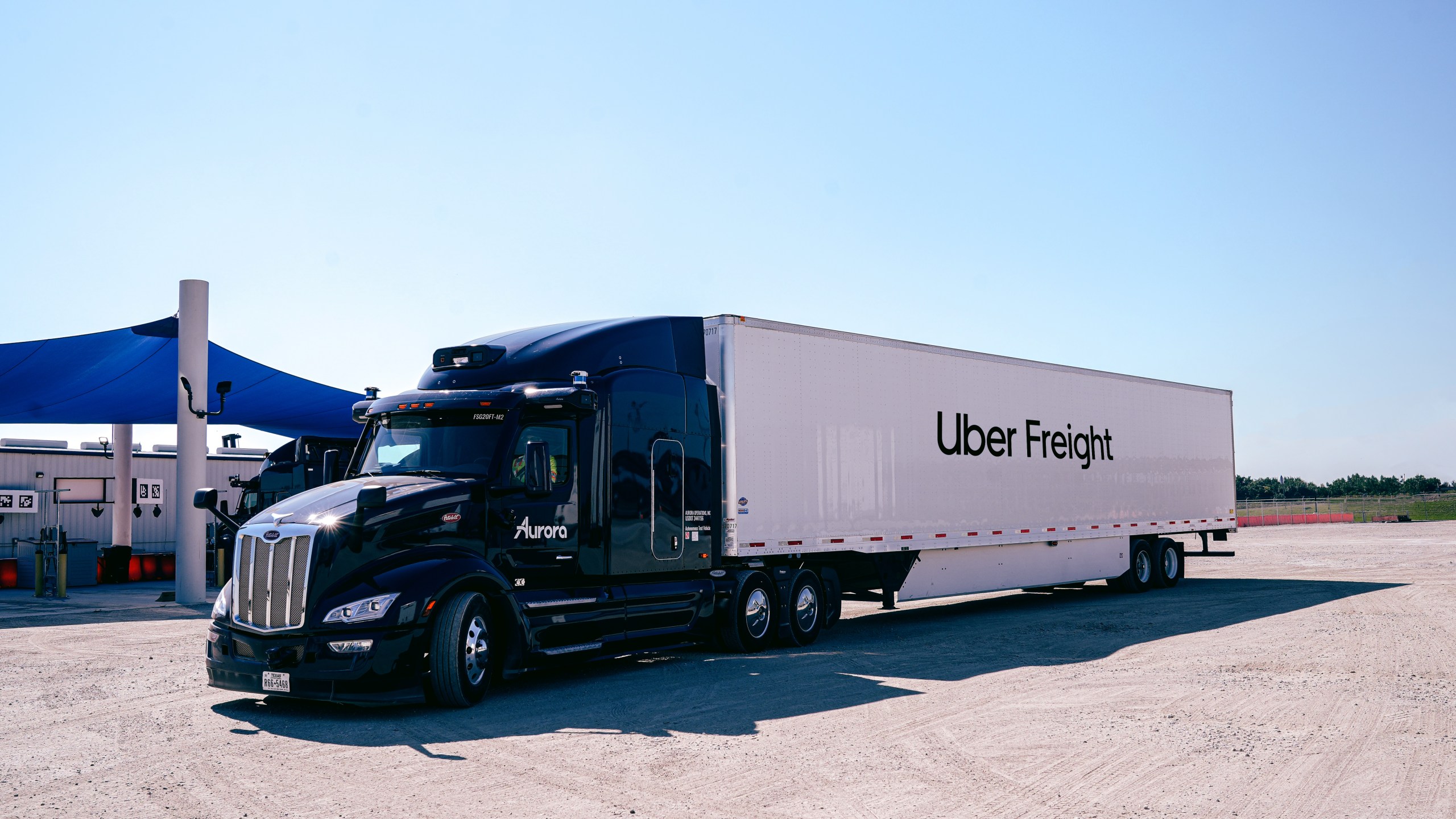 An Uber Freight truck parked in a lot.