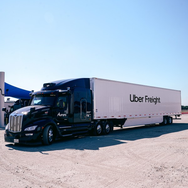 An Uber Freight truck parked in a lot.