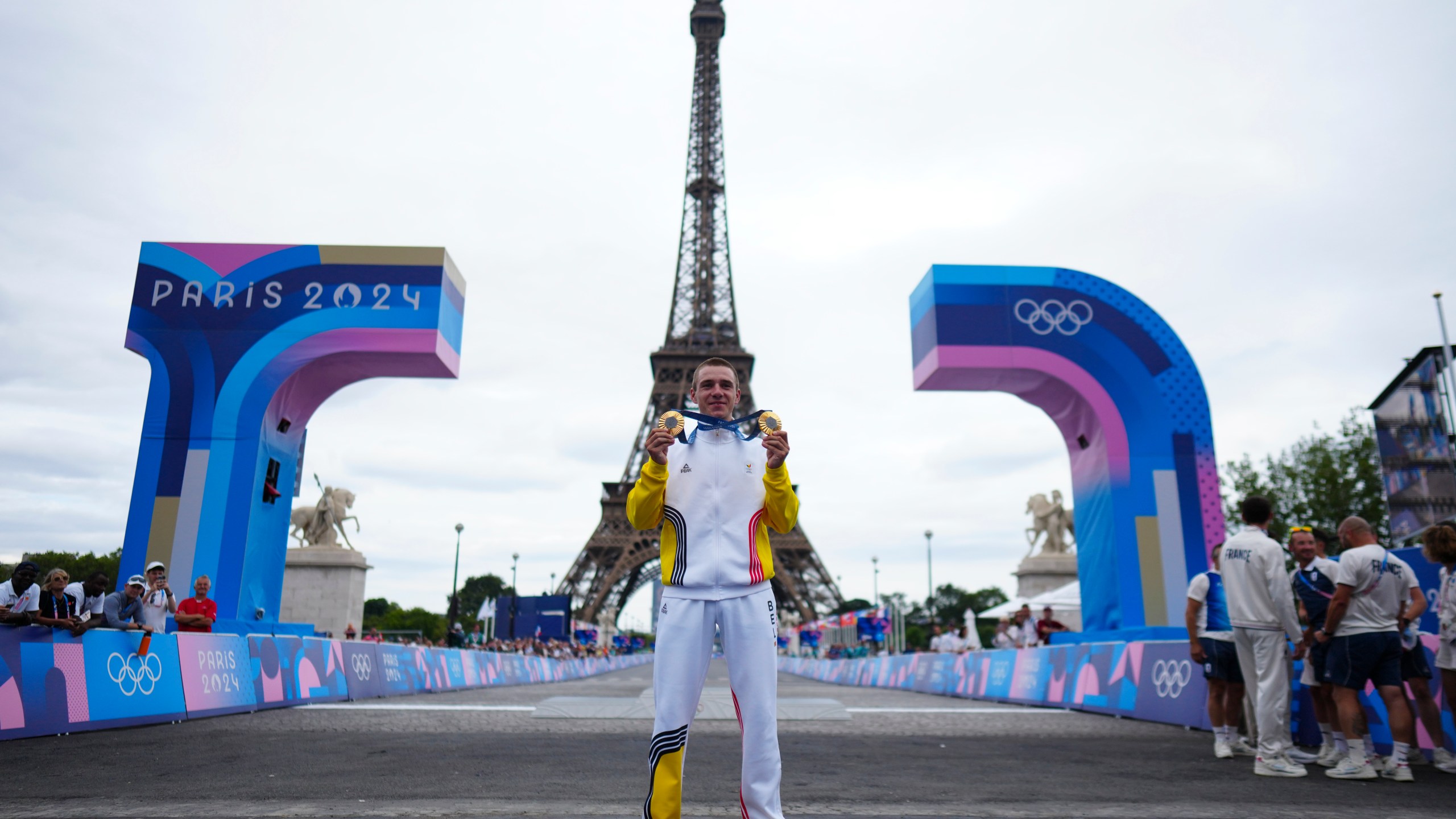 Remco Evenepoel, of Belgium, shows his gold medals of the men's time trial and road cycling events, at the 2024 Summer Olympics, Saturday, Aug. 3, 2024, in Paris, France. (AP Photo/Thibault Camus)