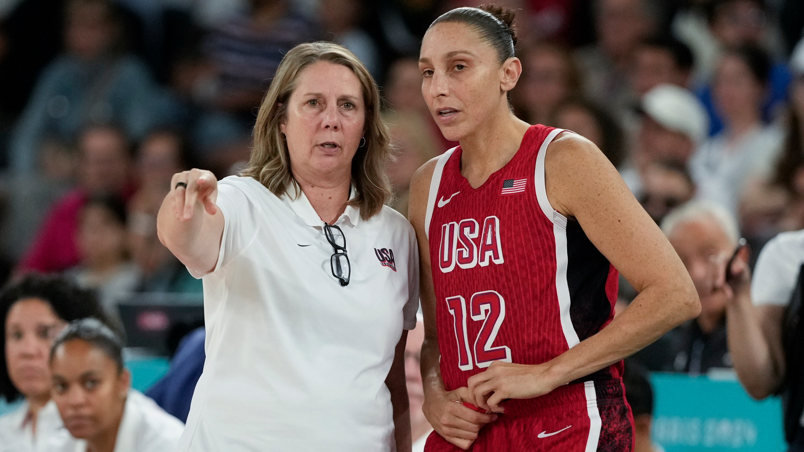 United States' Cheryl Reeve talks with Diana Taurasi (12) during a women's quarterfinal game against Nigeria at Bercy Arena at the 2024 Summer Olympics, Wednesday, Aug. 7, 2024, in Paris, France. (AP Photo/Mark J. Terrill)