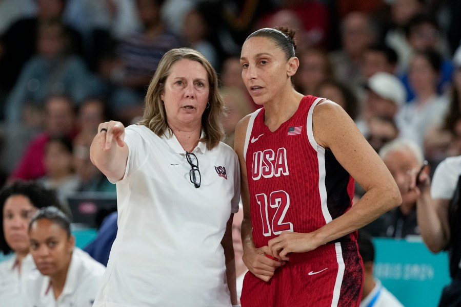 United States' Cheryl Reeve talks with Diana Taurasi (12) during a women's quarterfinal game against Nigeria at Bercy Arena at the 2024 Summer Olympics, Wednesday, Aug. 7, 2024, in Paris, France. (AP Photo/Mark J. Terrill)