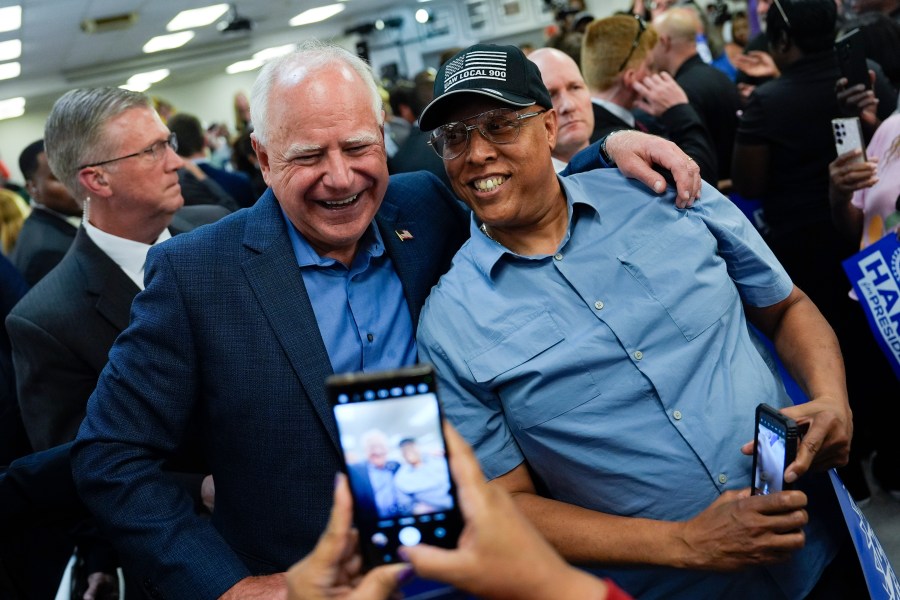 Democratic vice presidential nominee Minnesota Gov. Tim Walz meets union members during a campaign rally at UAW Local 900, Thursday, August 8, 2024, in Wayne, Mich., also attended by Democratic presidential nominee Vice President Kamala Harris. (AP Photo/Julia Nikhinson)