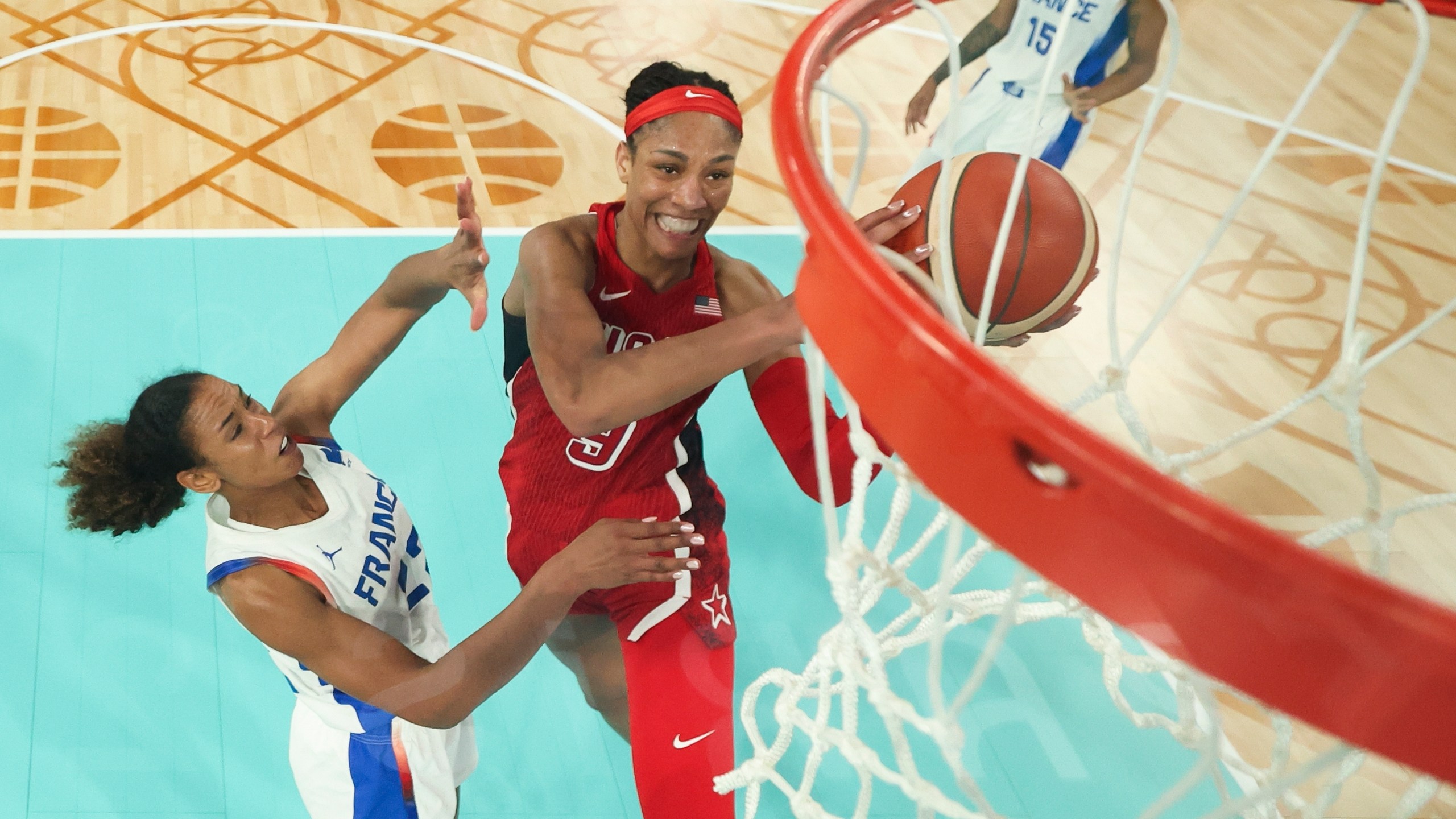 United States' A'ja Wilson, (9) shoots for a basket as Marieme Badiane (22), attempts tp block, during a women's gold medal basketball game between the United States and France at Bercy Arena at the 2024 Summer Olympics, Sunday, Aug. 11, 2024, in Paris, France. (Gregory Shamus/Pool Photo via AP)