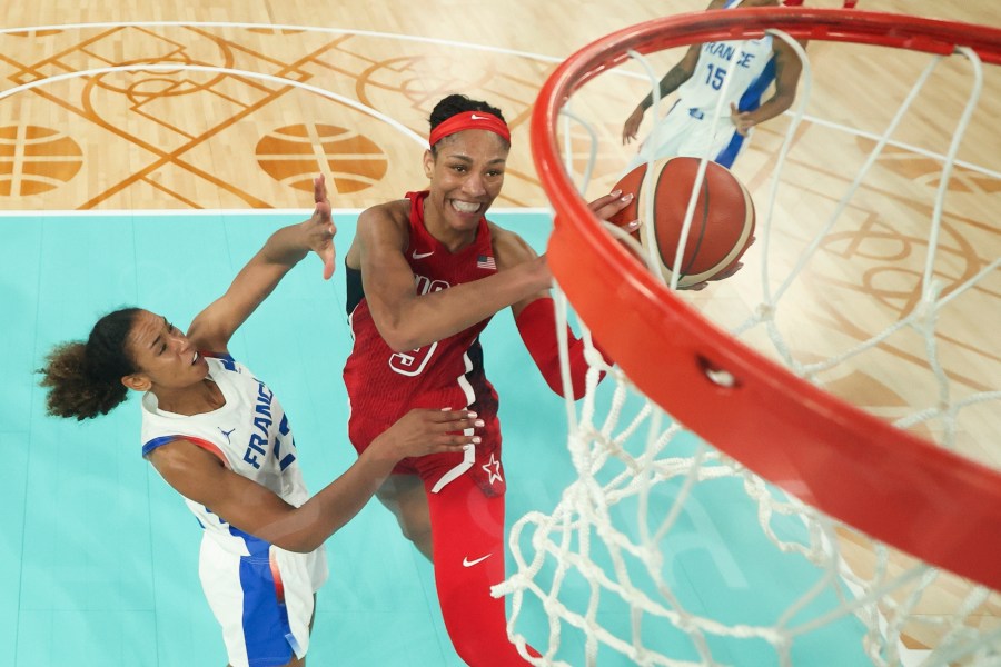 United States' A'ja Wilson, (9) shoots for a basket as Marieme Badiane (22), attempts tp block, during a women's gold medal basketball game between the United States and France at Bercy Arena at the 2024 Summer Olympics, Sunday, Aug. 11, 2024, in Paris, France. (Gregory Shamus/Pool Photo via AP)