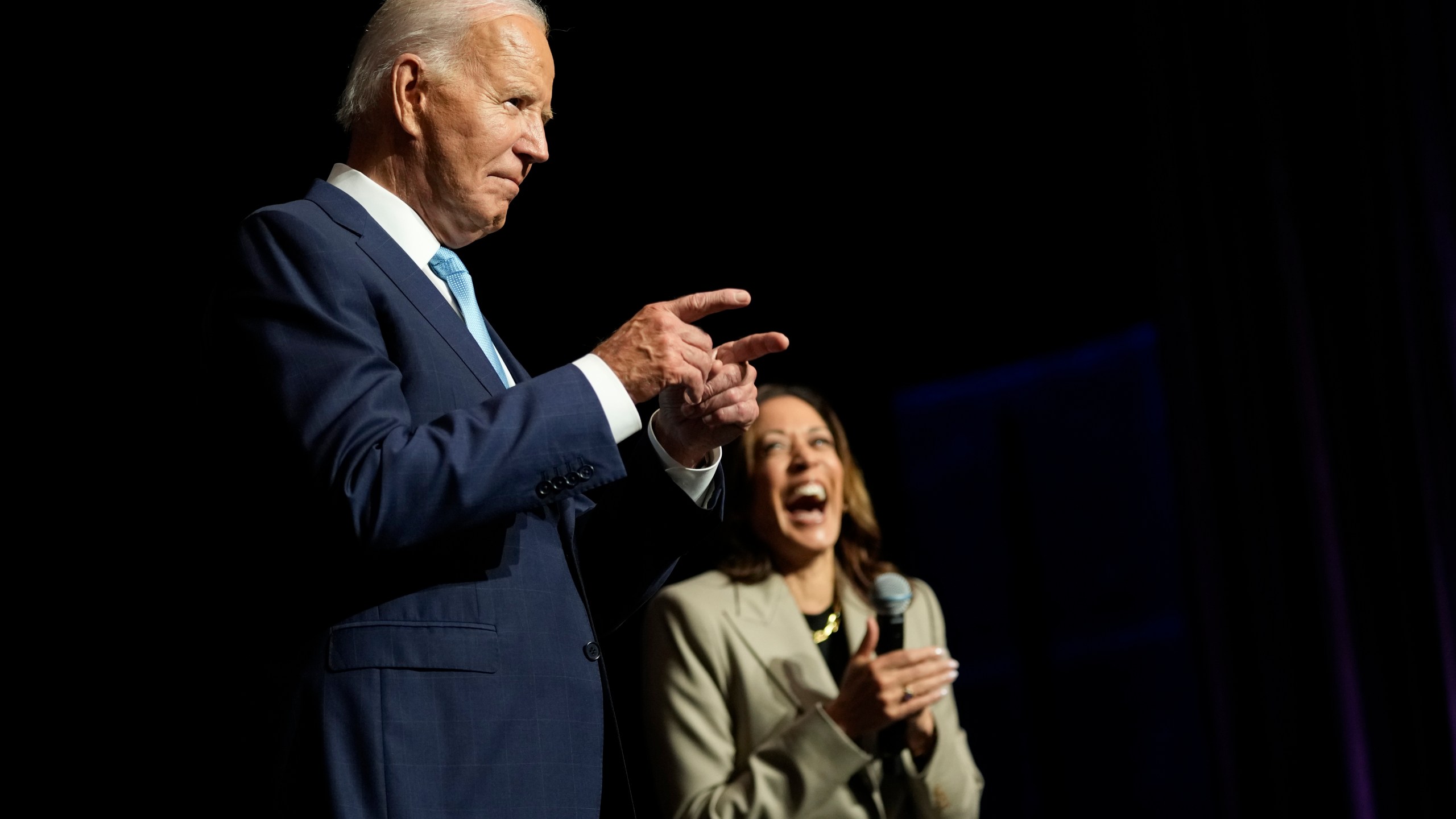 President Joe Biden gestures to the crowd as he speaks alongside Democratic presidential nominee Vice President Kamala Harris about the administration's efforts to lower prescription drug costs during an event at Prince George's Community College in Largo, Md., Thursday, Aug. 15, 2024. (AP Photo/Susan Walsh)