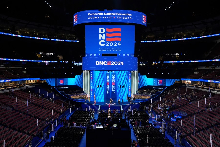 Workers prepare the convention floor at United Center before the Democratic National Convention Sunday, Aug. 18, 2024, in Chicago. (AP Photo/Paul Sancya)