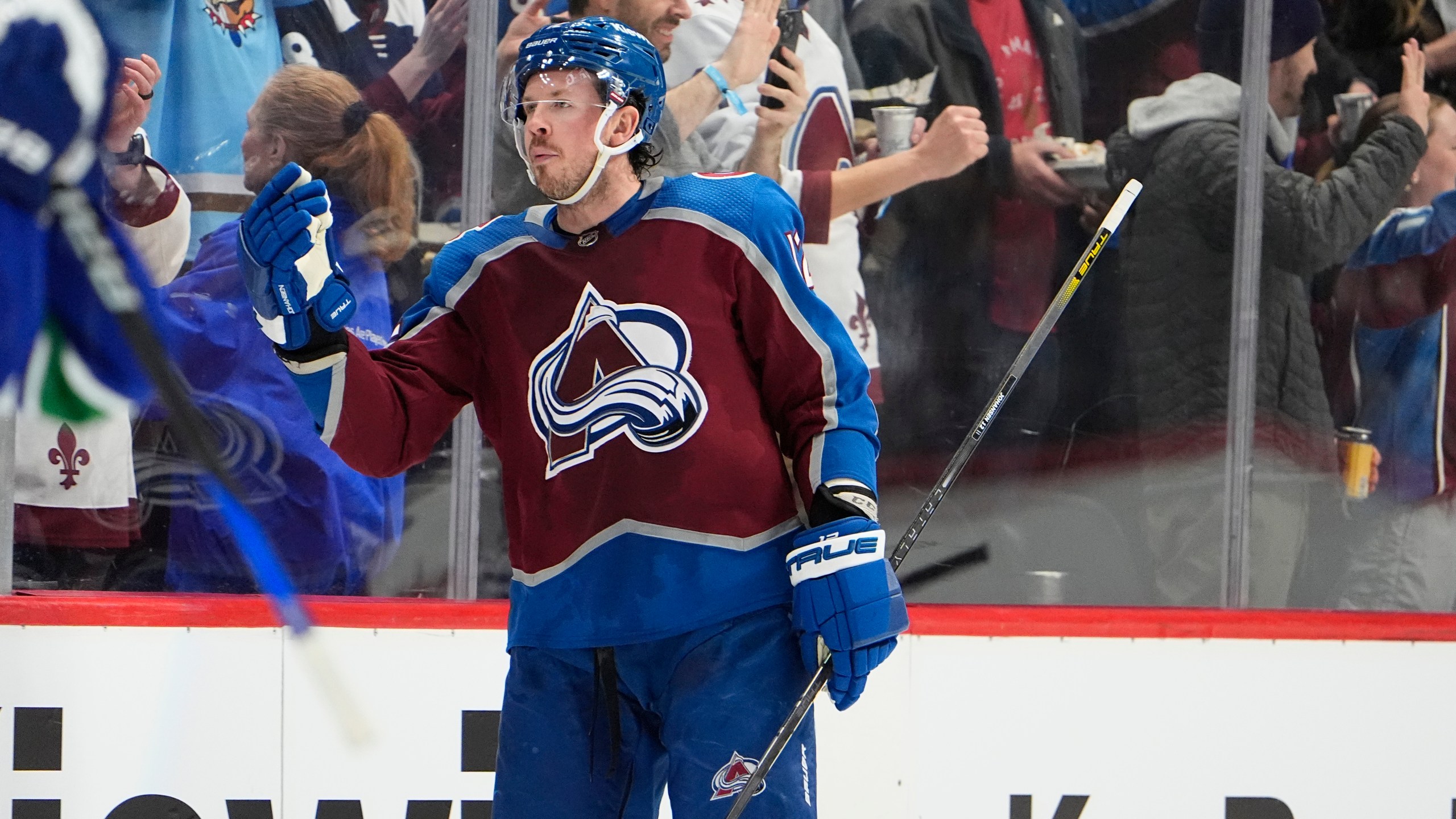 FILE - Colorado Avalanche center Ryan Johansen (12) is congratulated after scoring a goal in the second period of an NHL hockey game, Feb. 20, 2024, in Denver. (AP Photo/David Zalubowski, File)