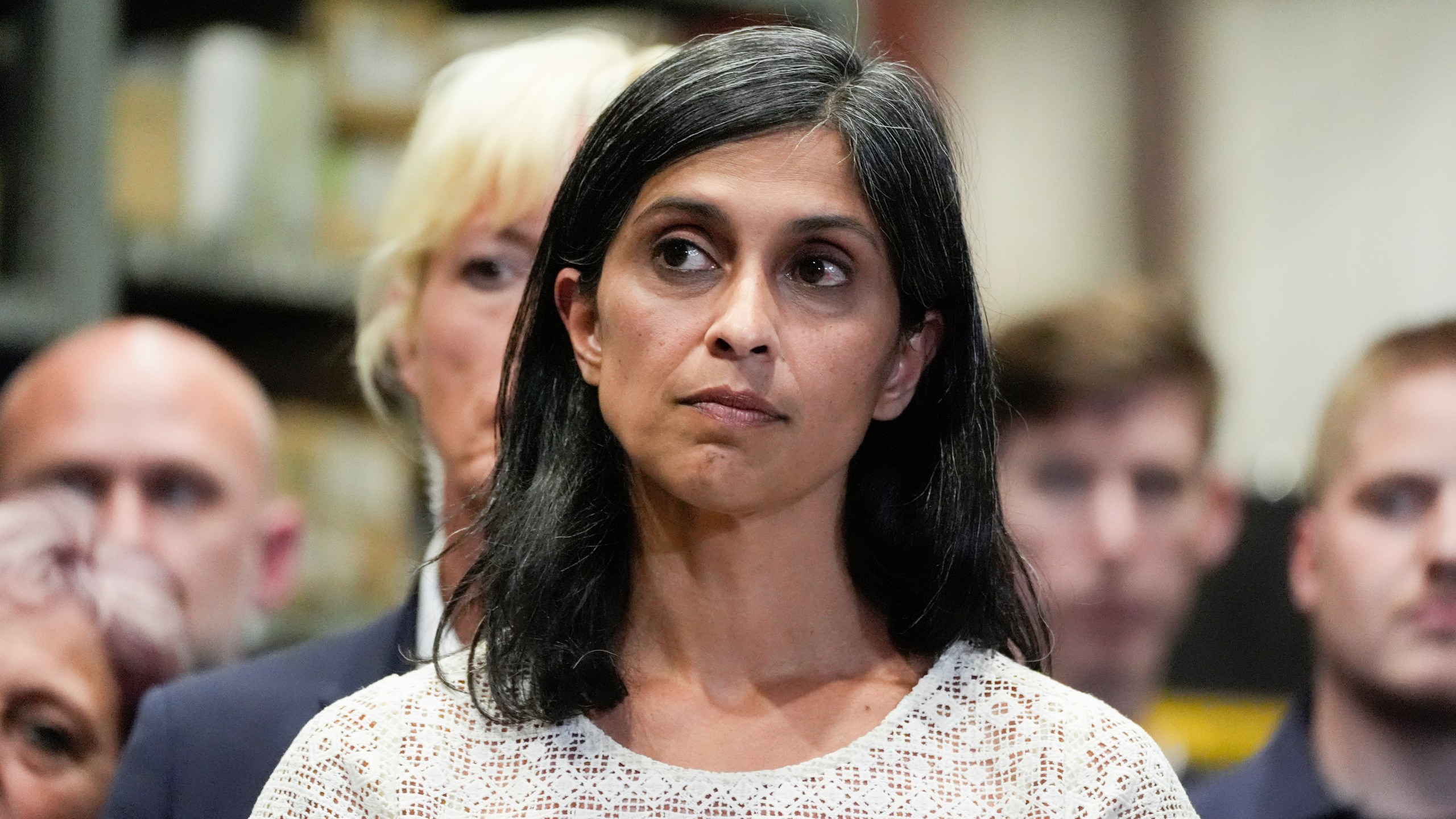 FILE - Usha Vance, wife of Republican vice presidential nominee Sen. JD Vance, R-Ohio, listens as he speaks at a campaign event, Aug. 7, 2024, in Eau Claire, Wis. (AP Photo/Alex Brandon, File)